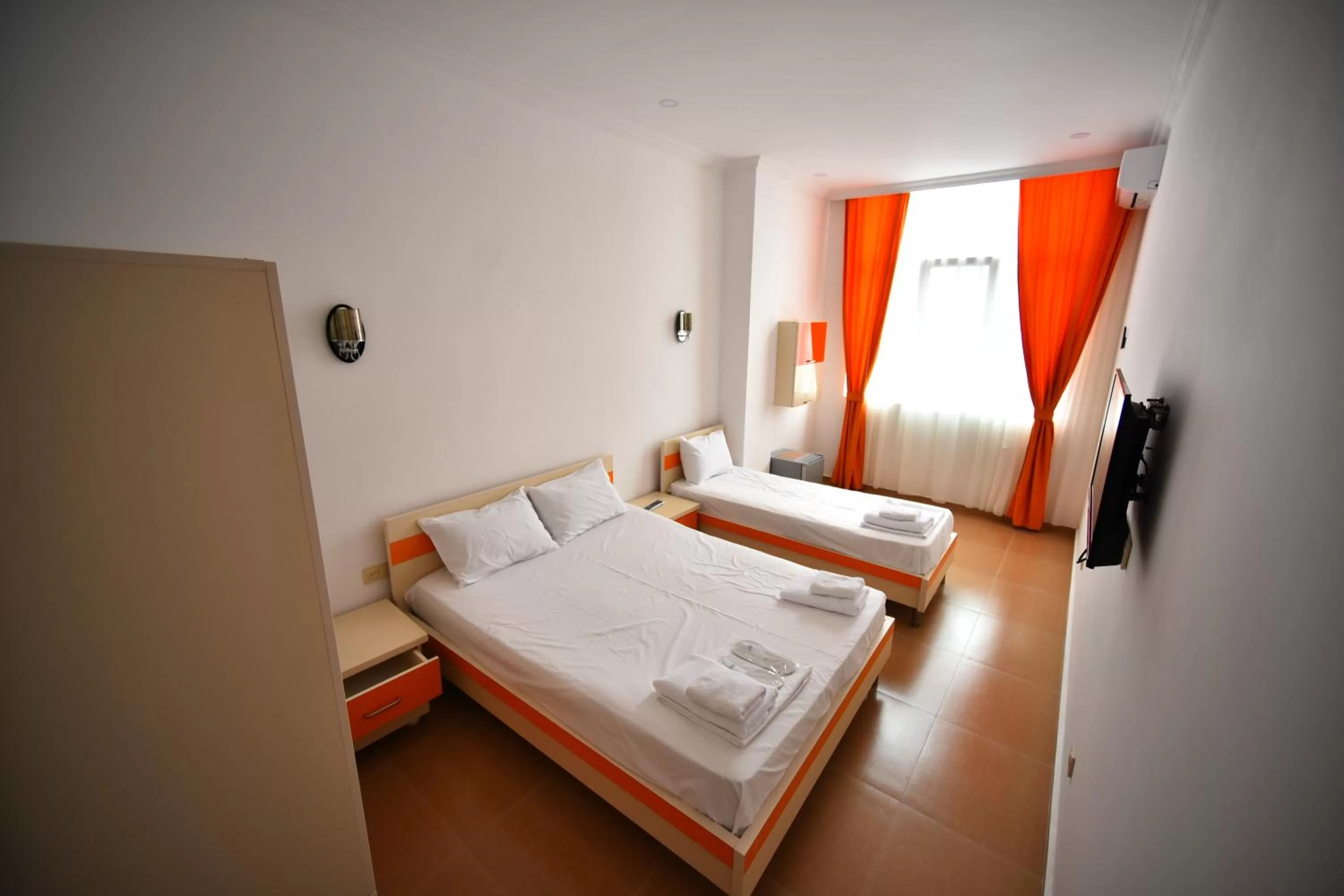 Bed in Orange Home Hotel