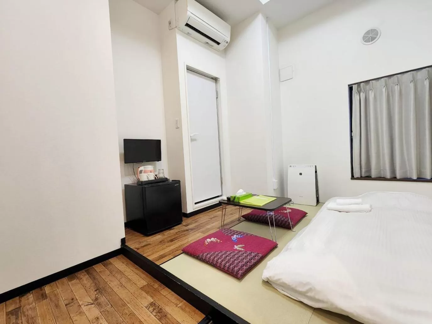 Bed in KYU KYU HOTEL