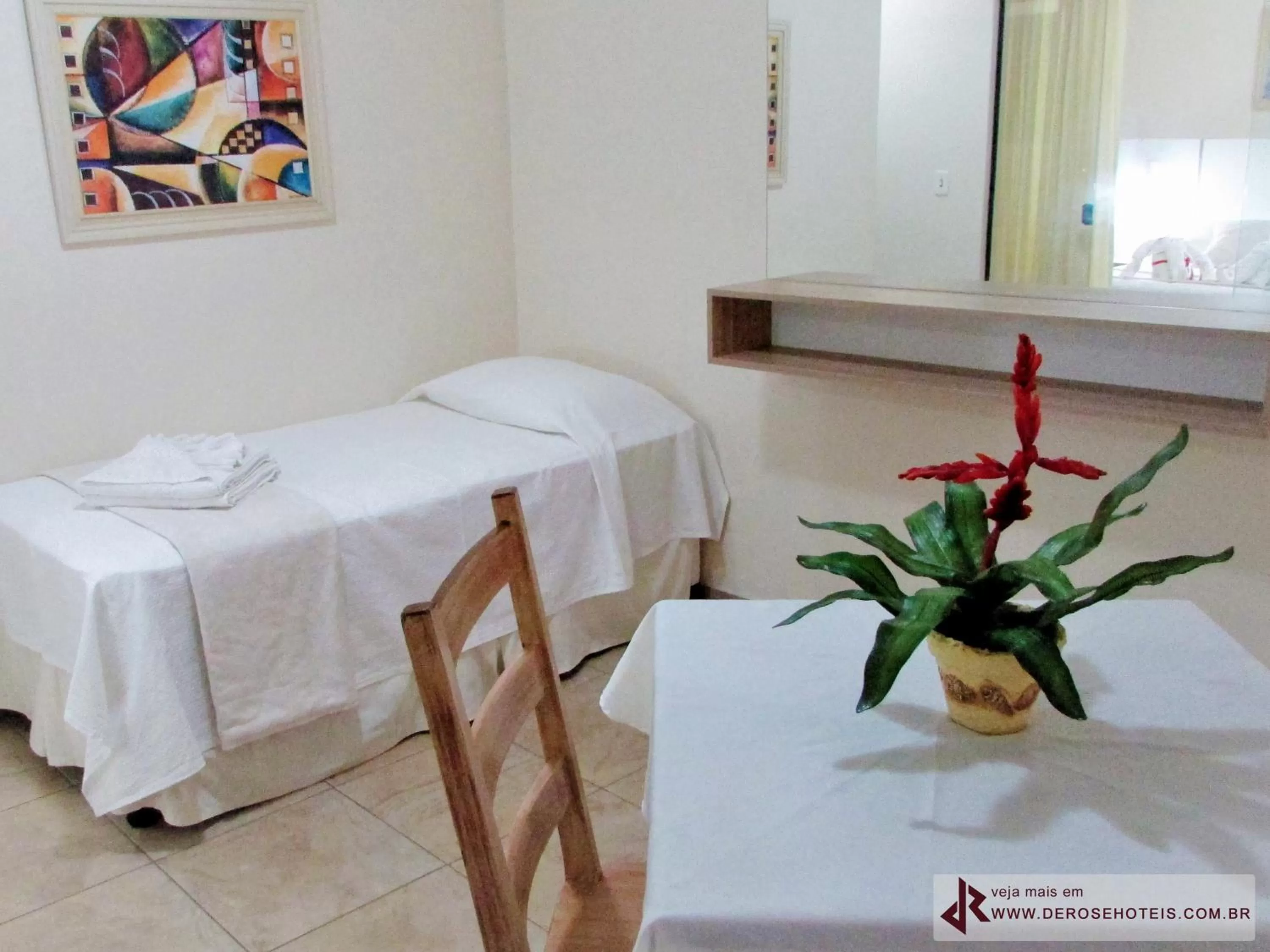 Bed in De Rose Palace Hotel