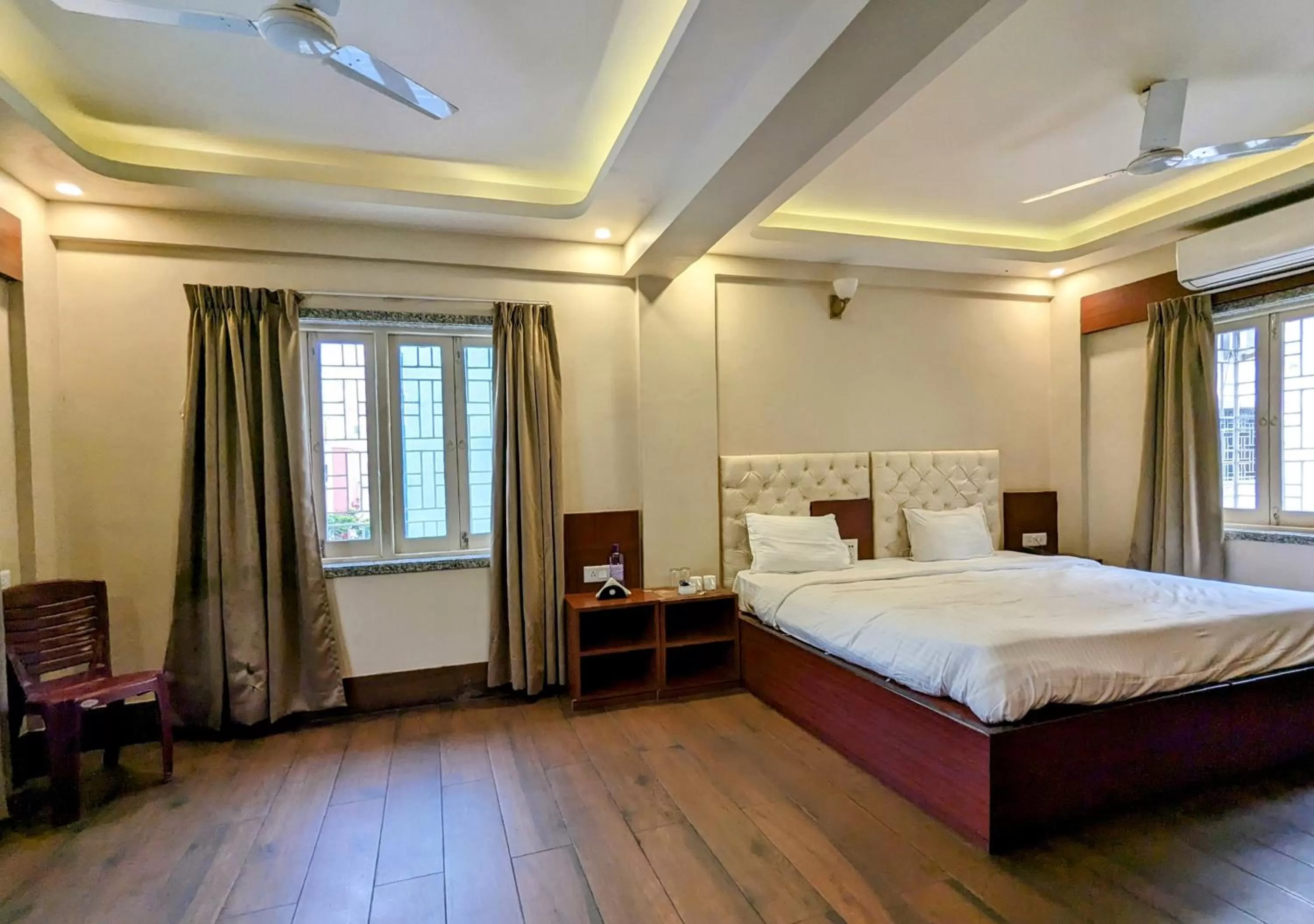 Photo of the whole room, Bed in The Aster Enclave Hotel
