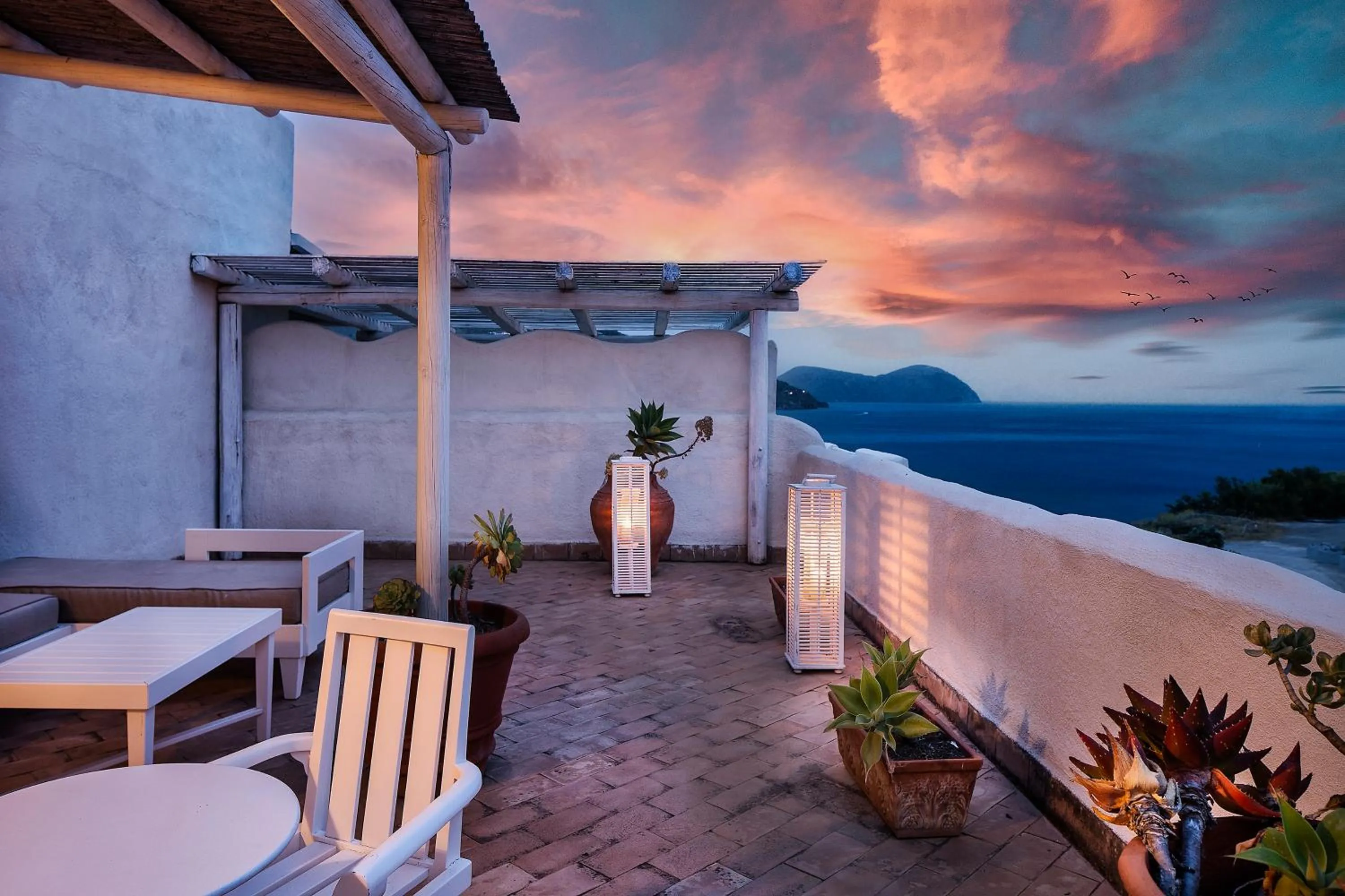 Patio in Therasia Resort Sea and SPA - The Leading Hotels of the World