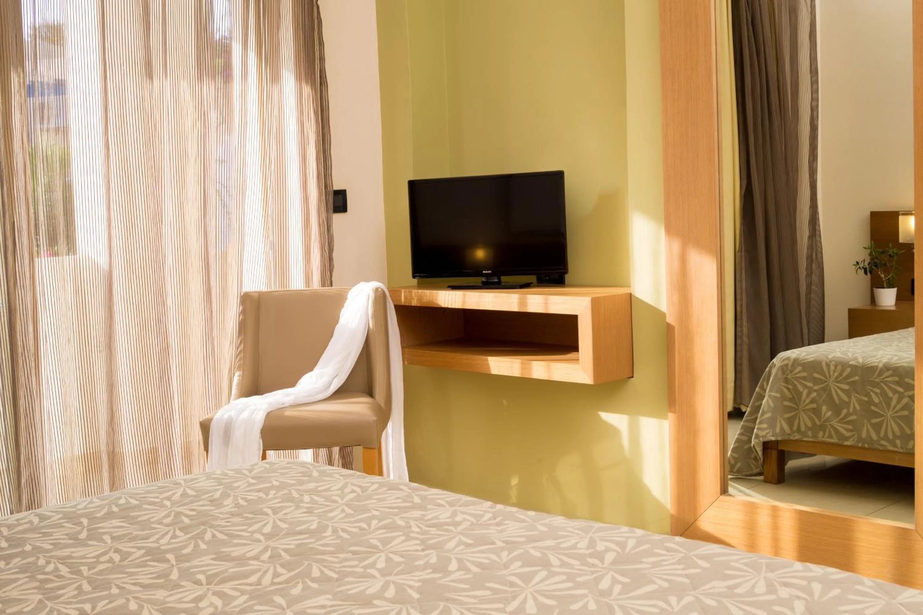 Seating area, Bed in Atlantica Amalthia Beach Hotel - Adults Only