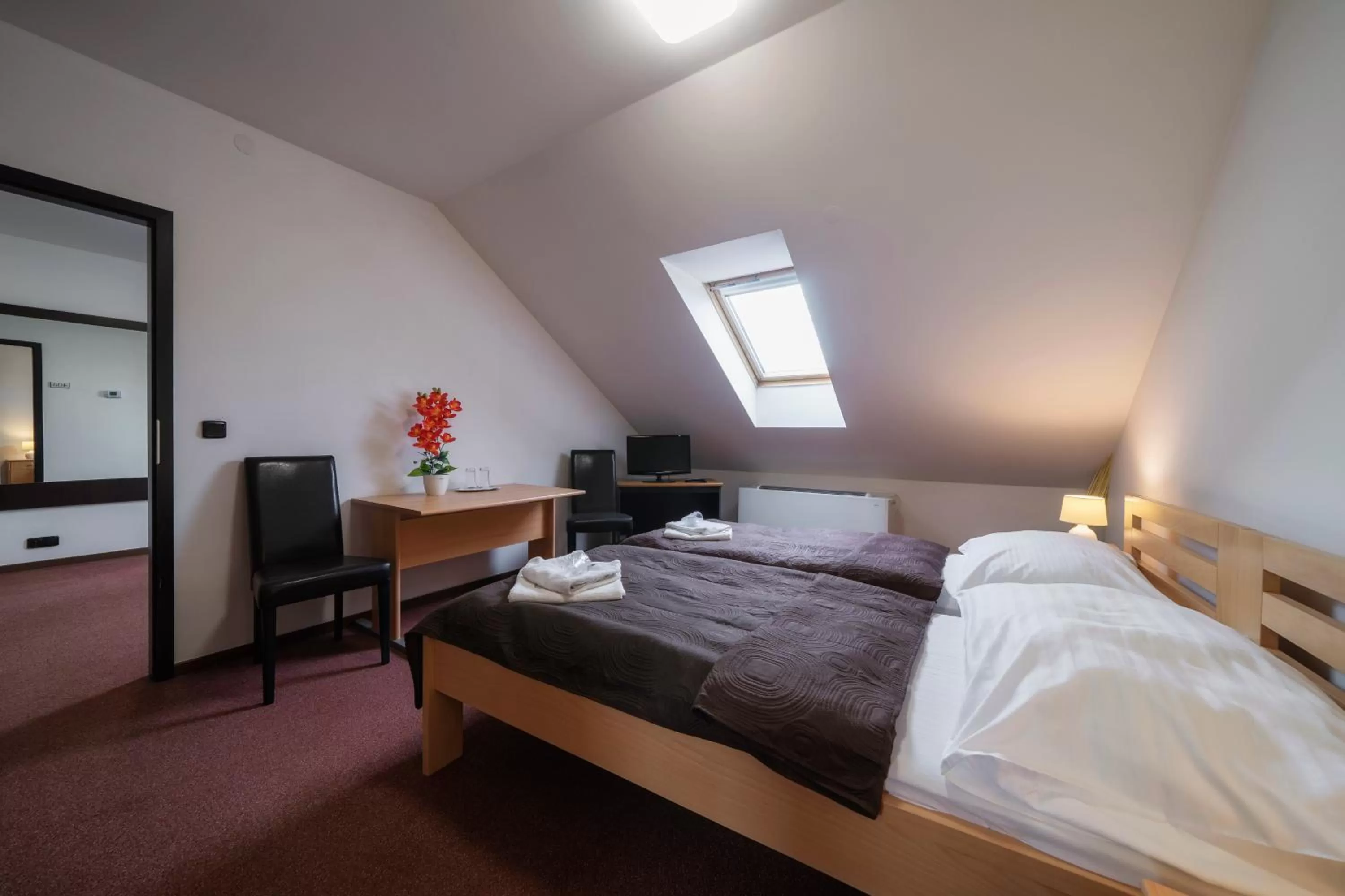 Communal lounge/ TV room, Bed in Hotel Astory Plzeň