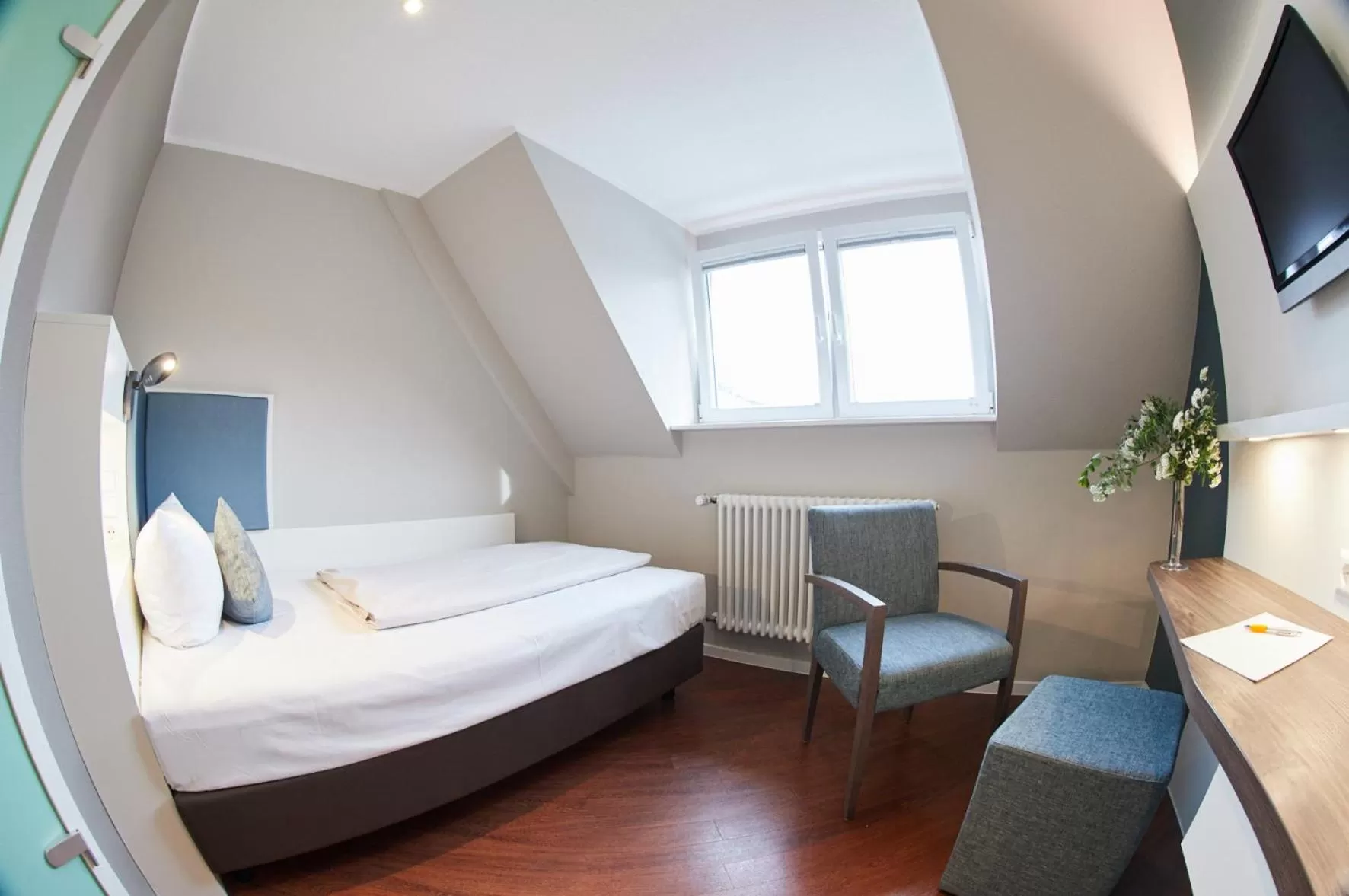 Photo of the whole room, Bed in Stadthotel Freiburg Kolping Hotels & Resorts