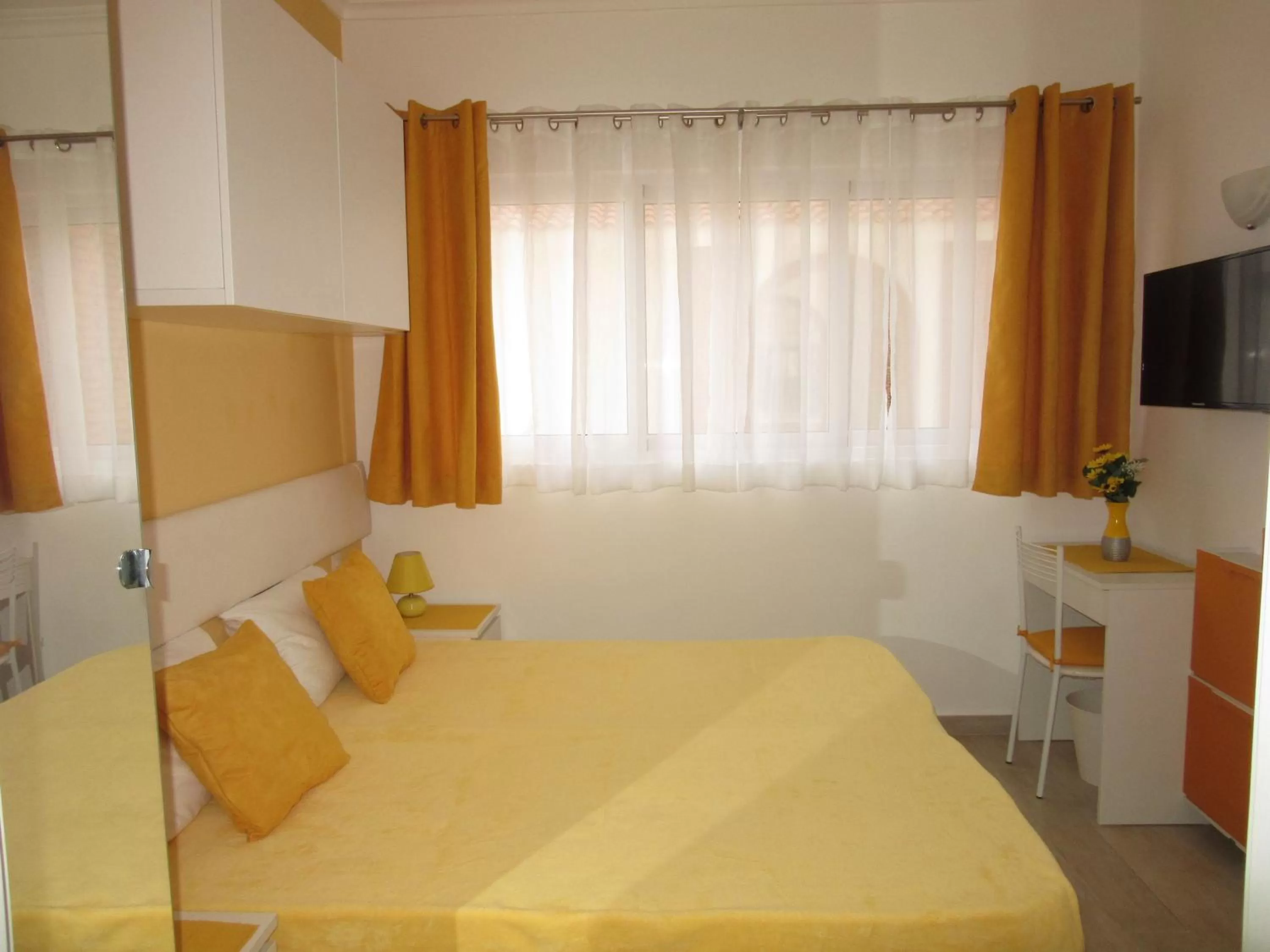 Bed in Coral Village - "Caribbean Cocktails" Deluxe Suites & Pool