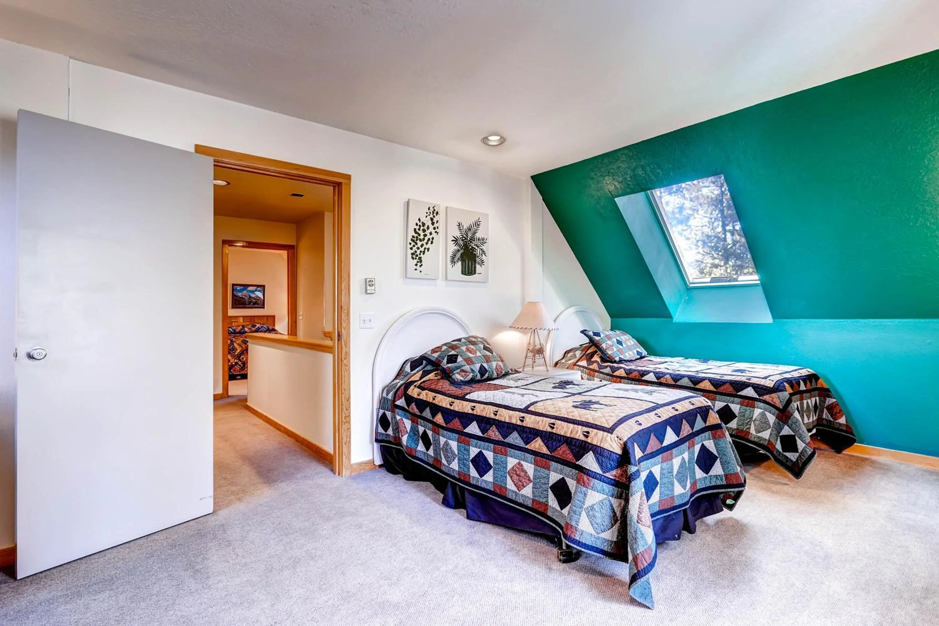 Bed in Evergreen Condominiums by Vail Resorts