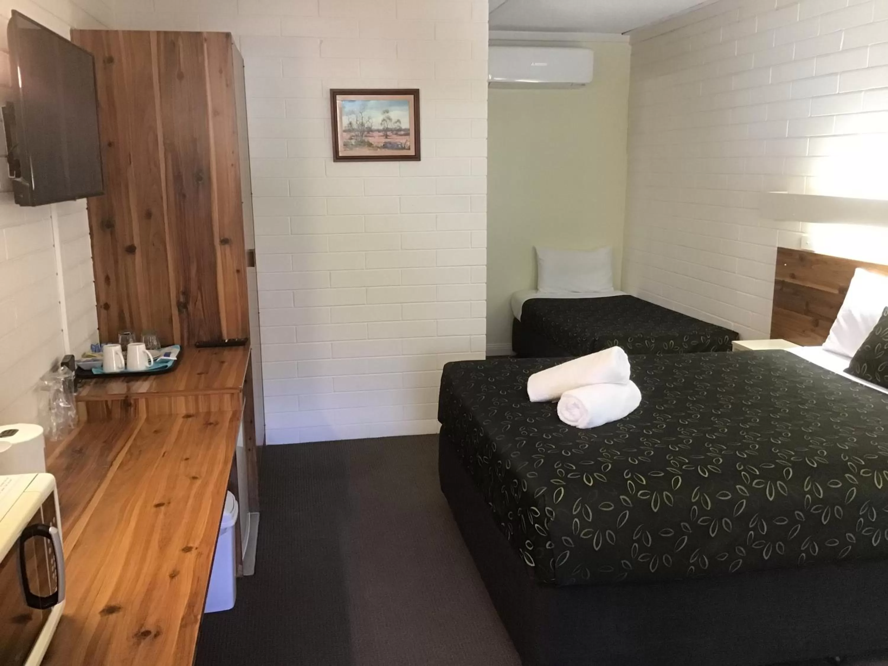 Bed in 7th Street Motel