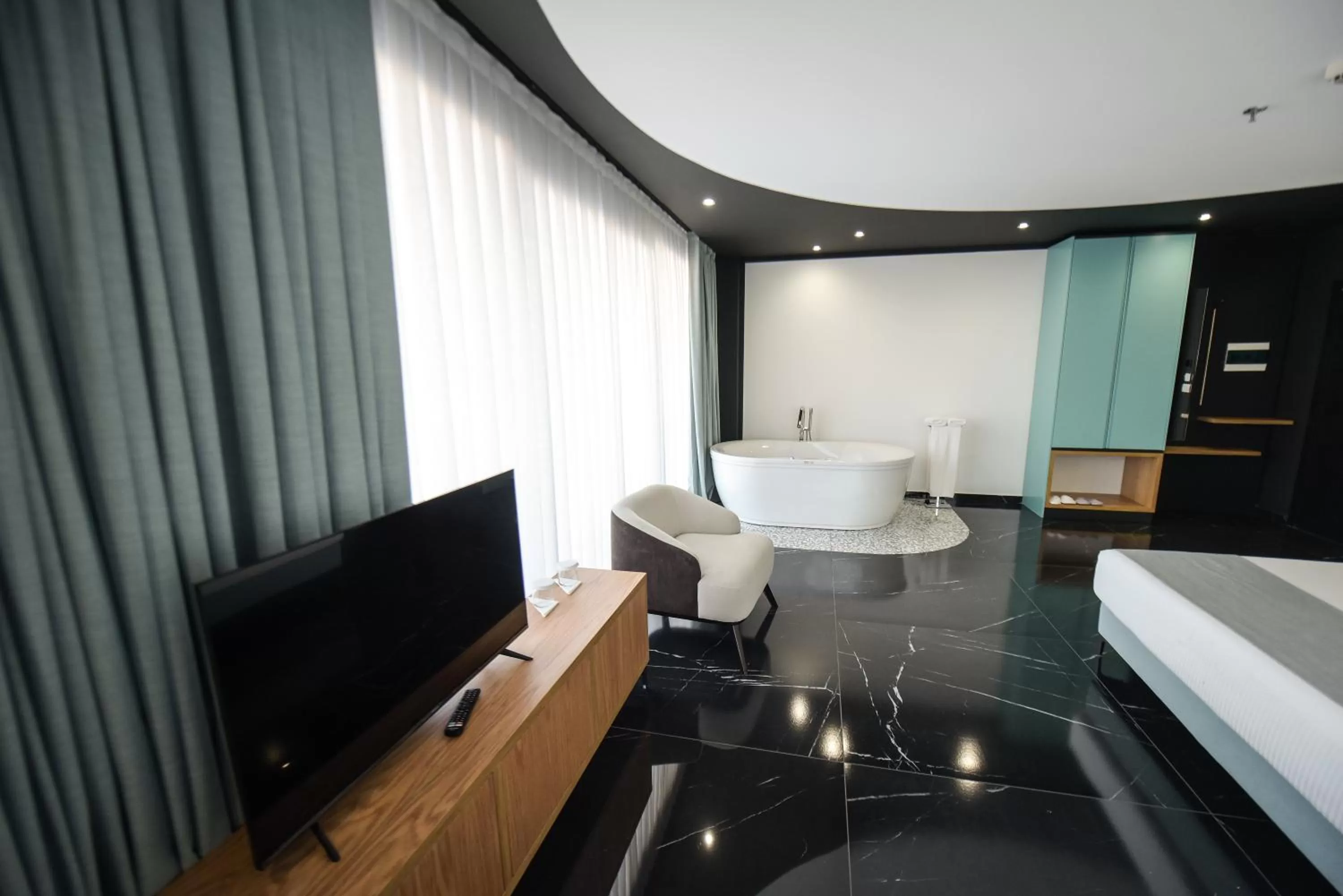 Communal lounge/ TV room, Bed in Amara Hotel & SPA