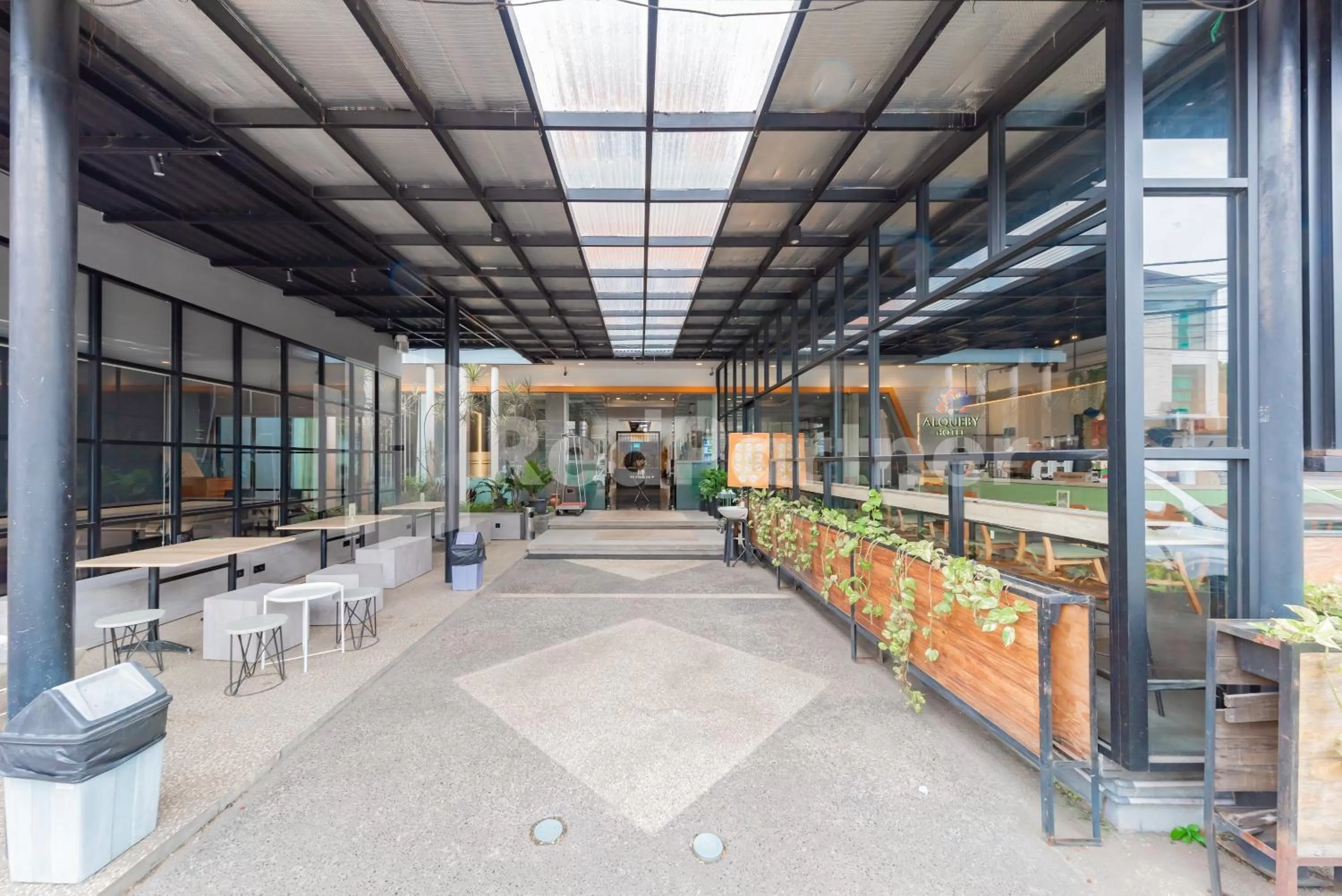 Property building in Alqueby Hotel near Kiara Artha Park & Trans Studio Mall Mitra RedDoorz