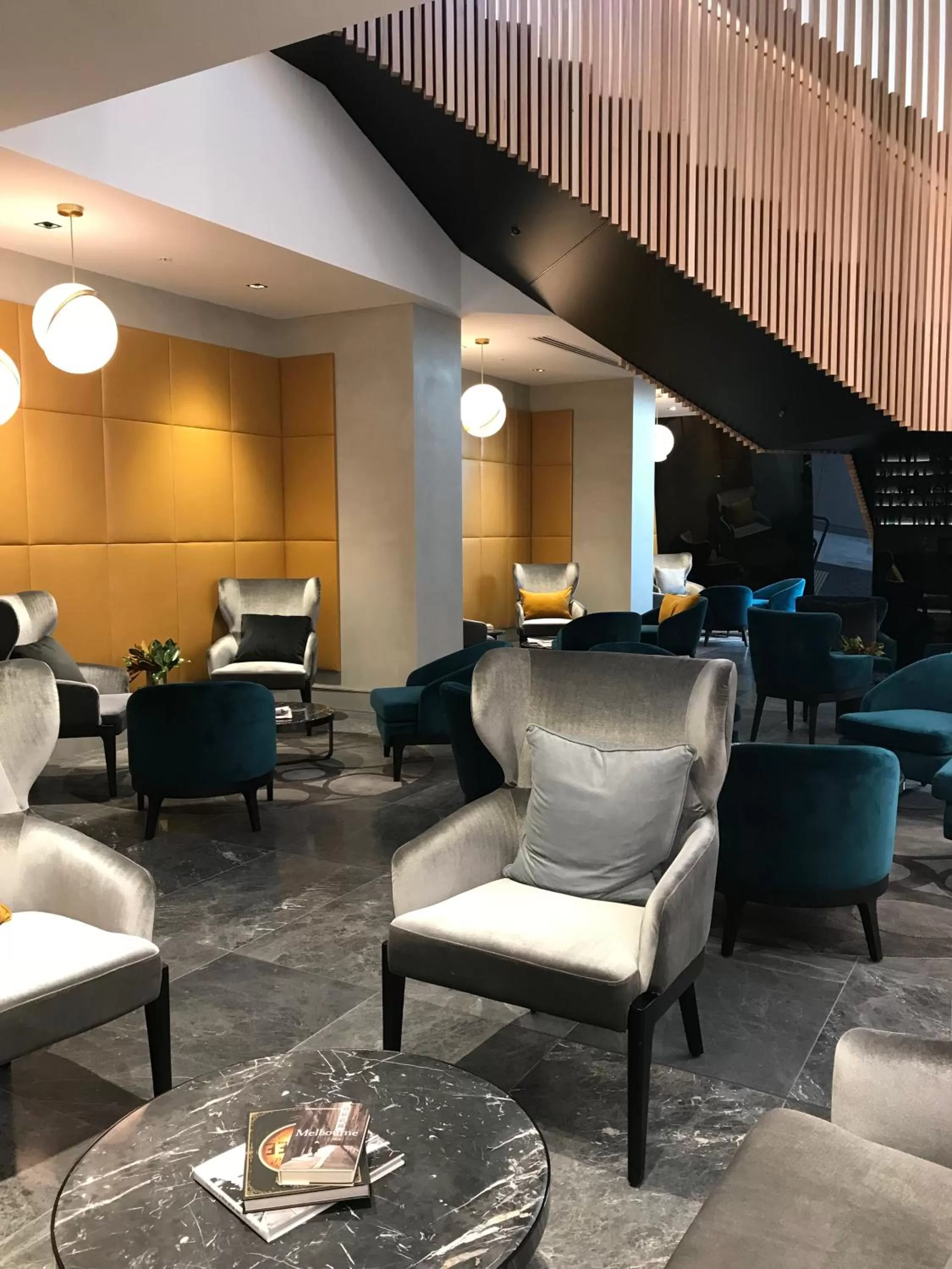 Communal lounge/ TV room in Novotel Melbourne South Wharf