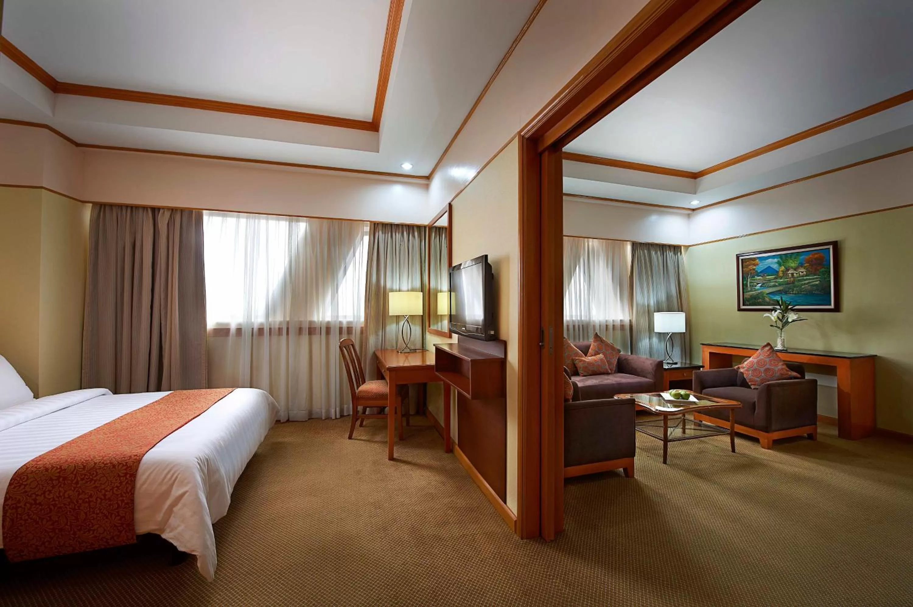 Seating area, Bed in Berjaya Makati Hotel
