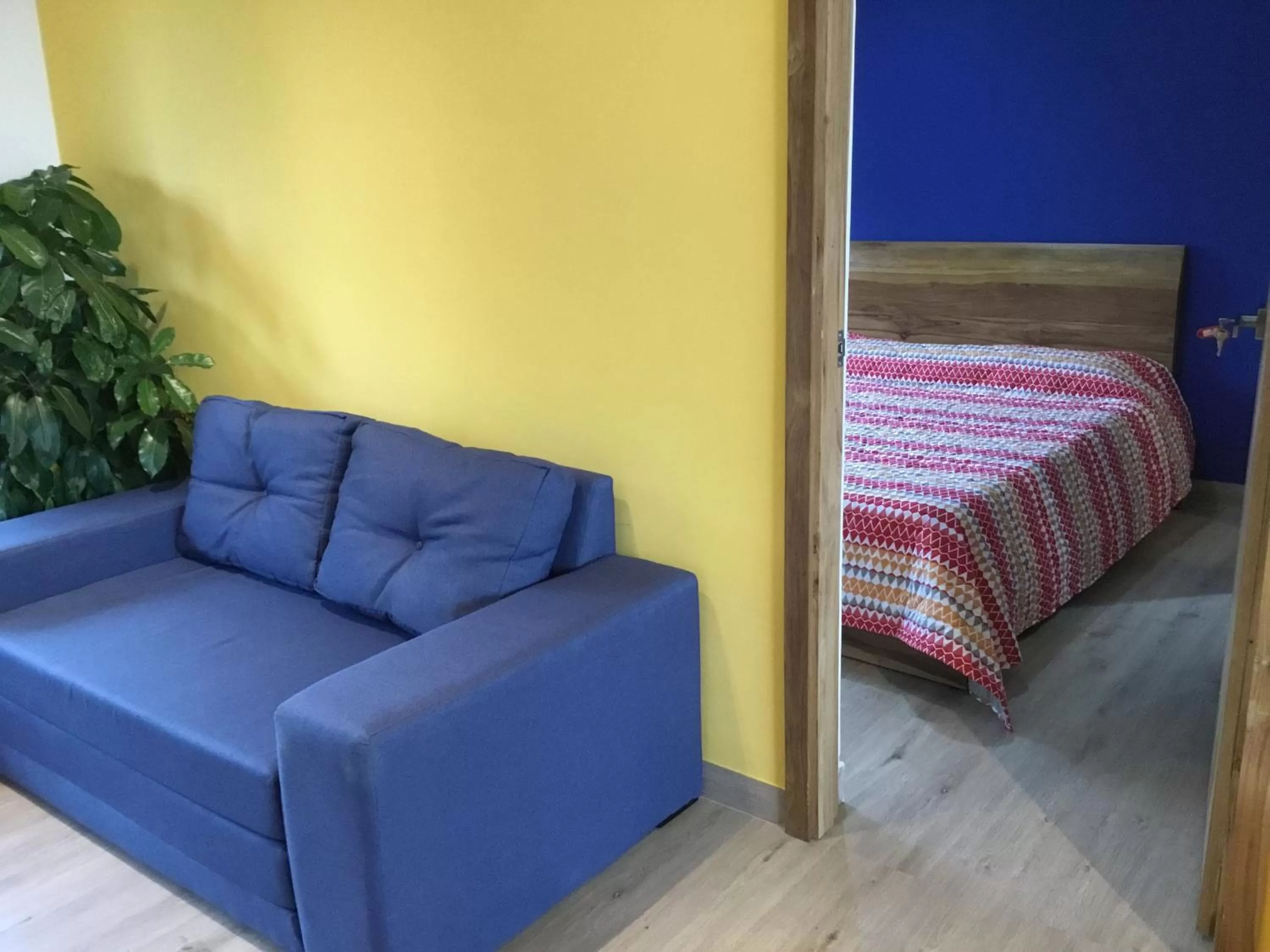 Bed, Seating Area in Hotel La Caracola