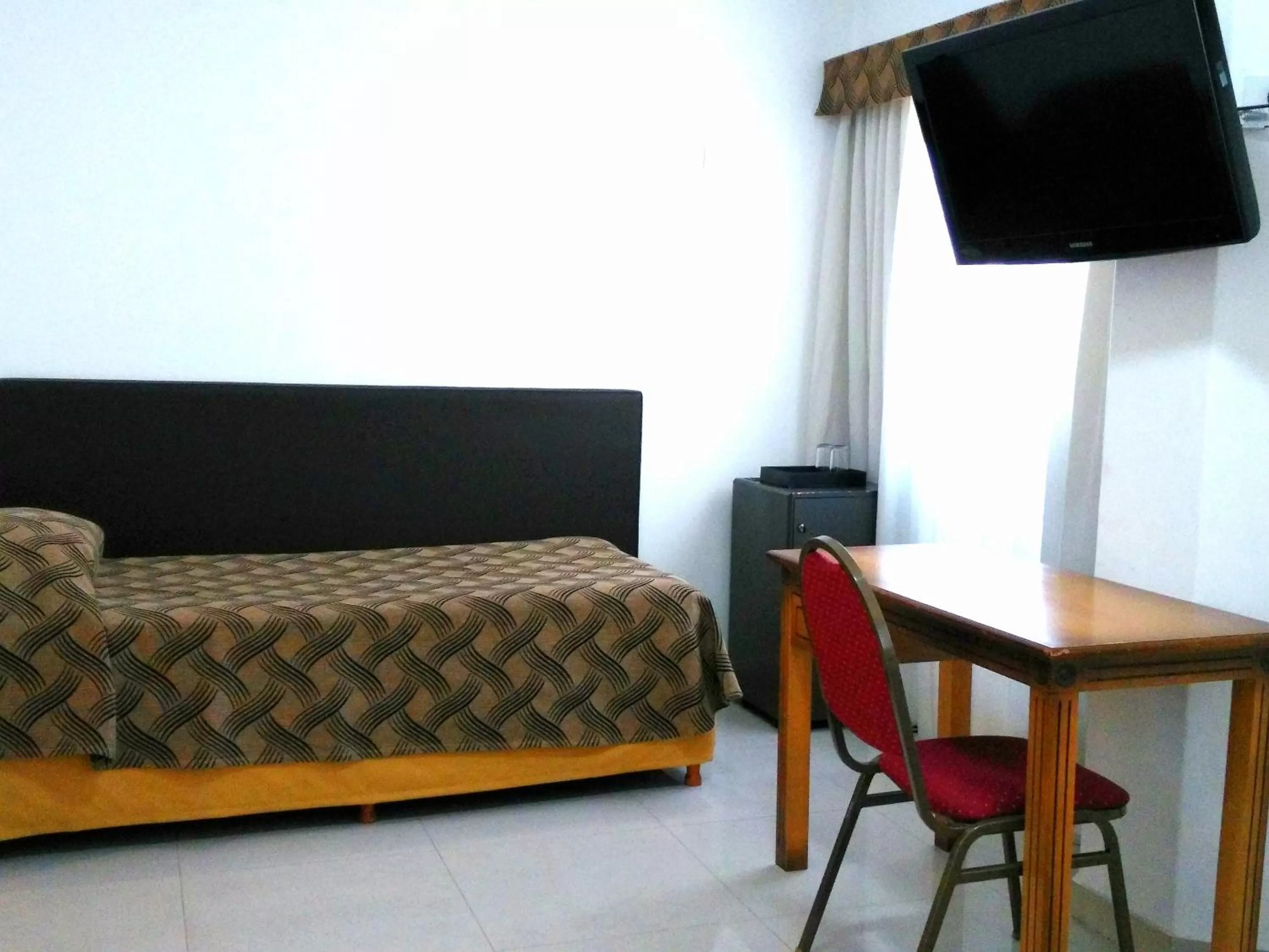 Bedroom, Bed in Tritone Hotel