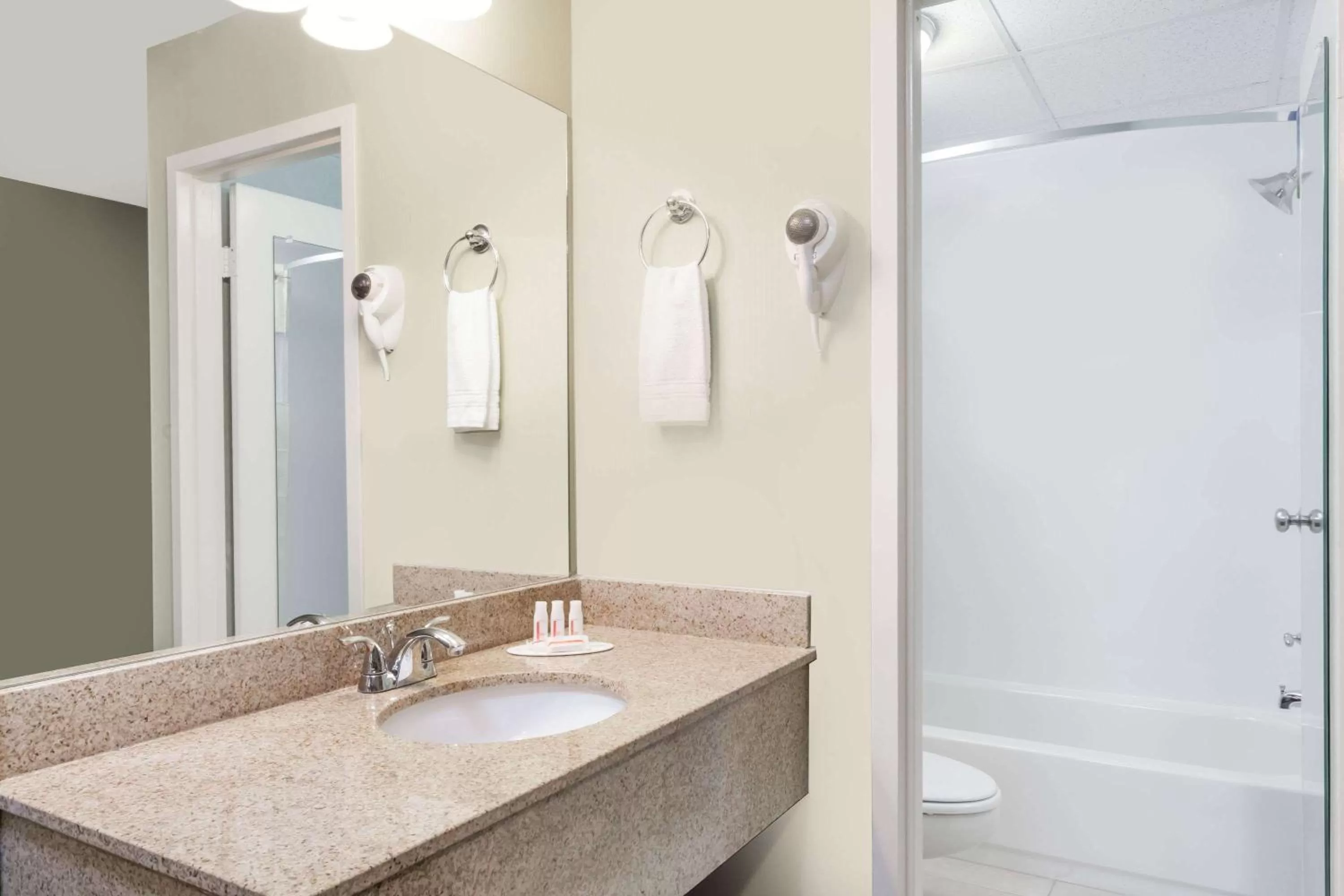 Bathroom in Days Inn by Wyndham Windsor Locks / Bradley Intl Airport