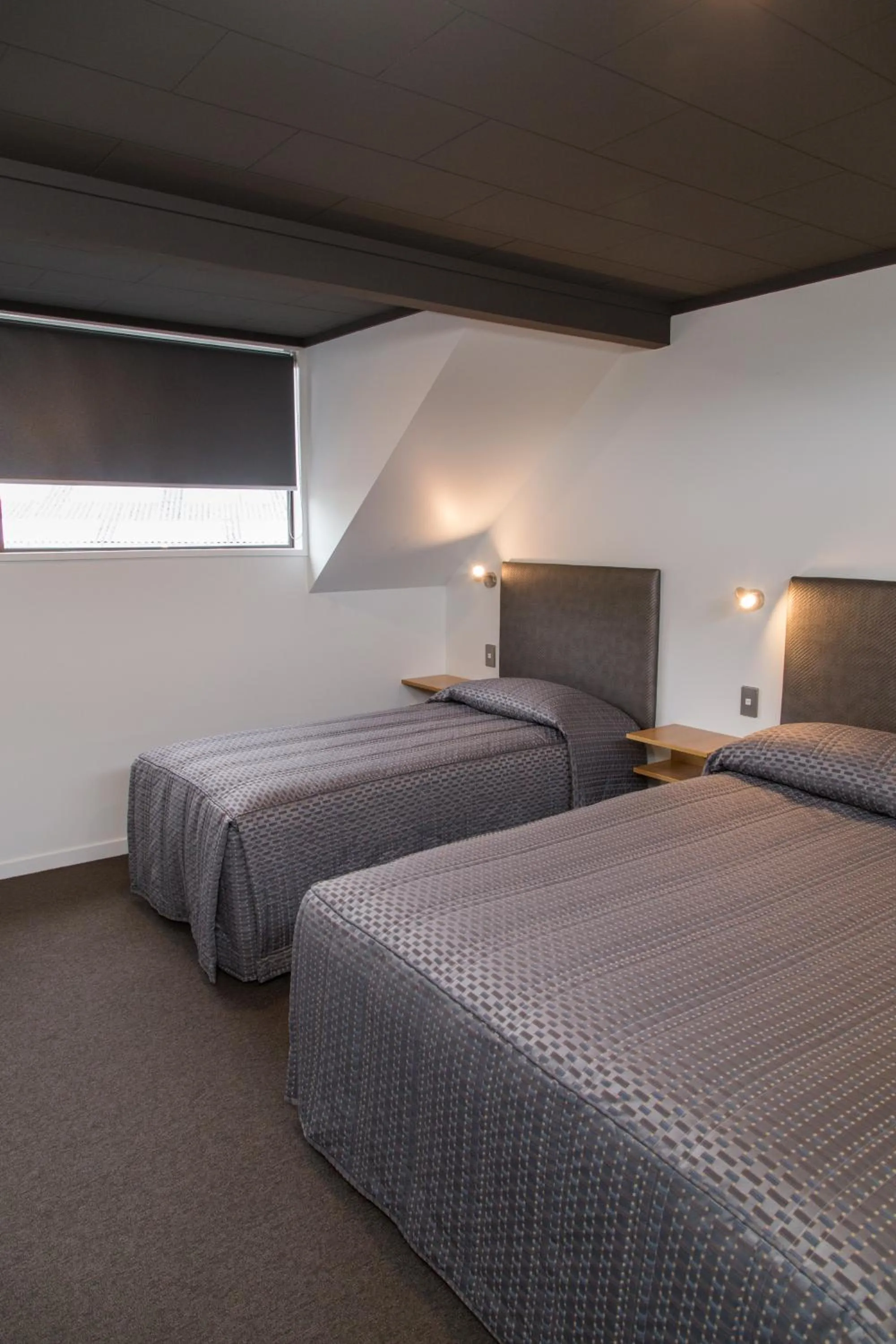 Bed in Dunedin Motel and Villas