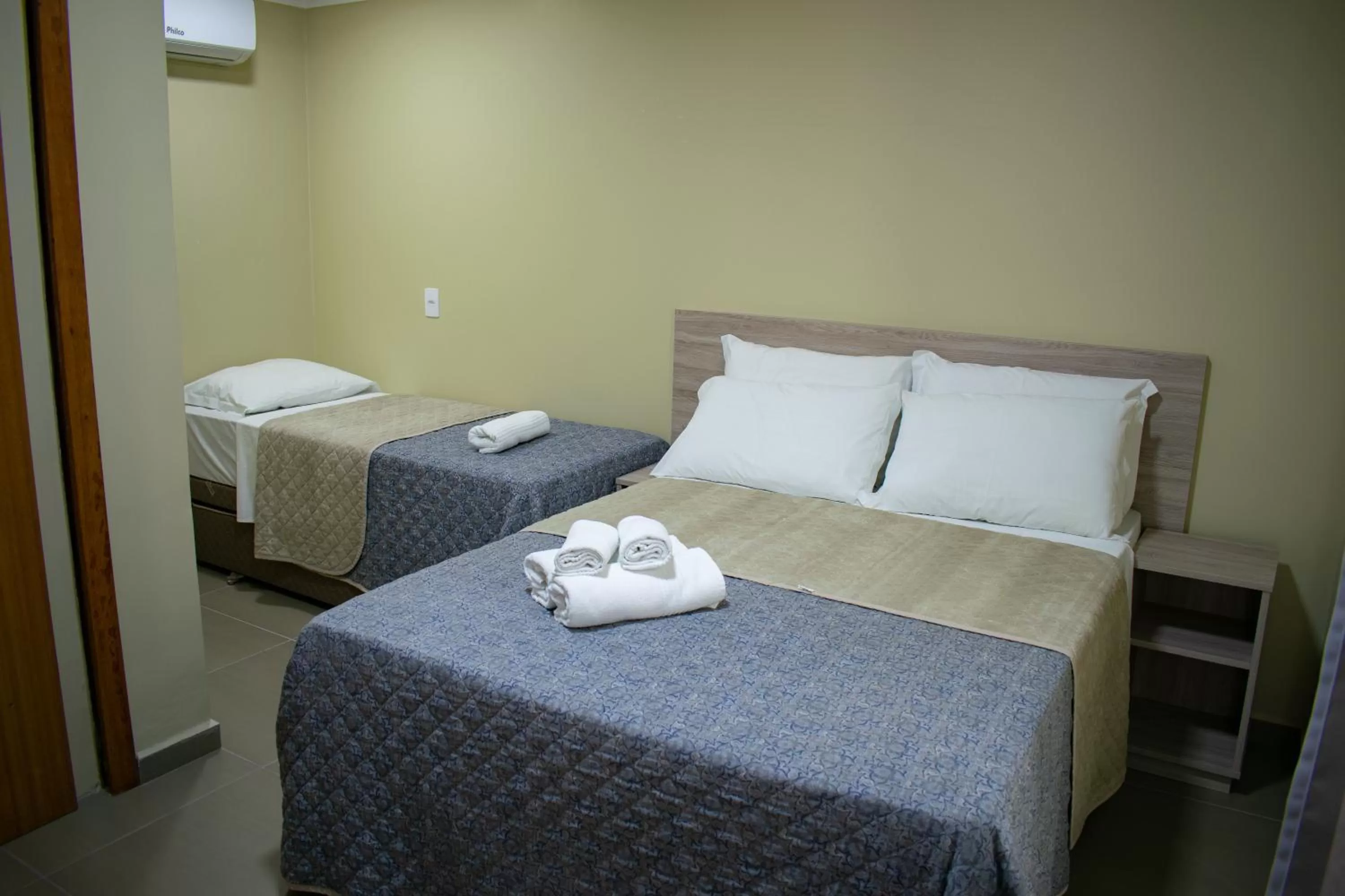 Bed in Pousada Tissiano