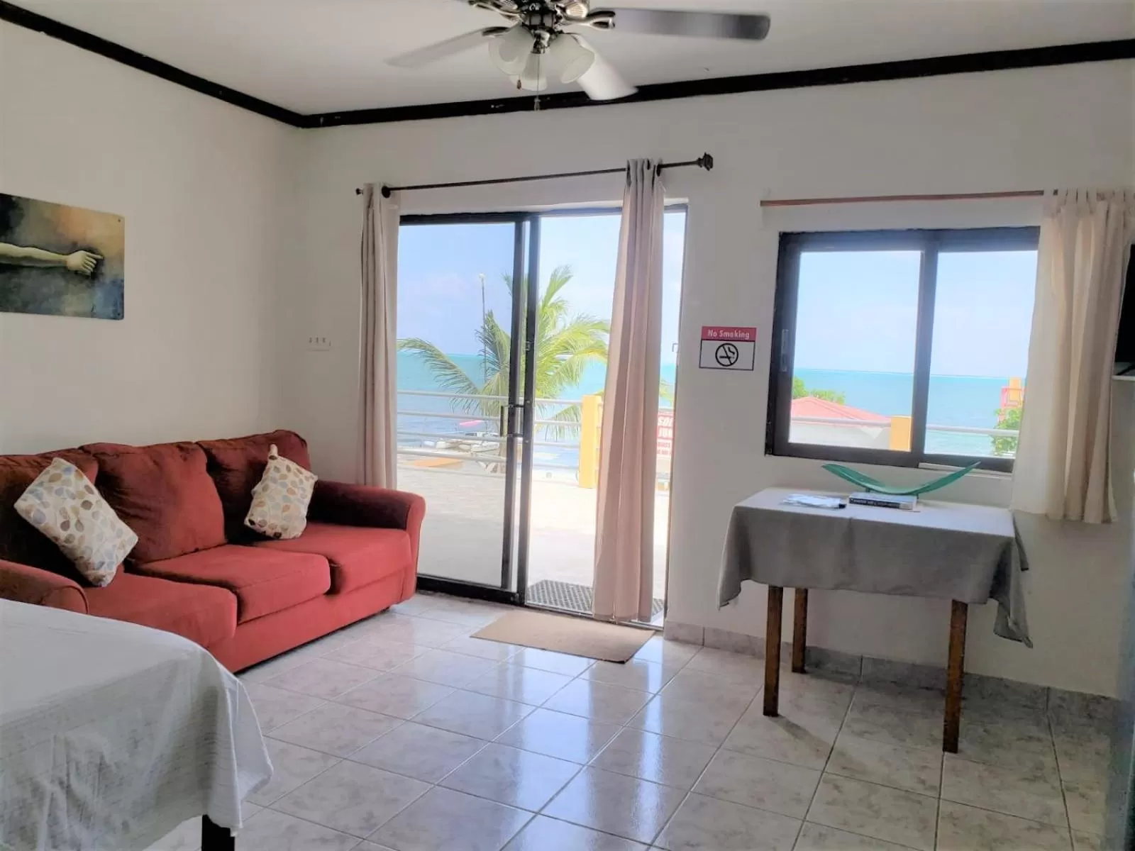Seating Area in Beach Side Condos Caye Caulker by CCVH