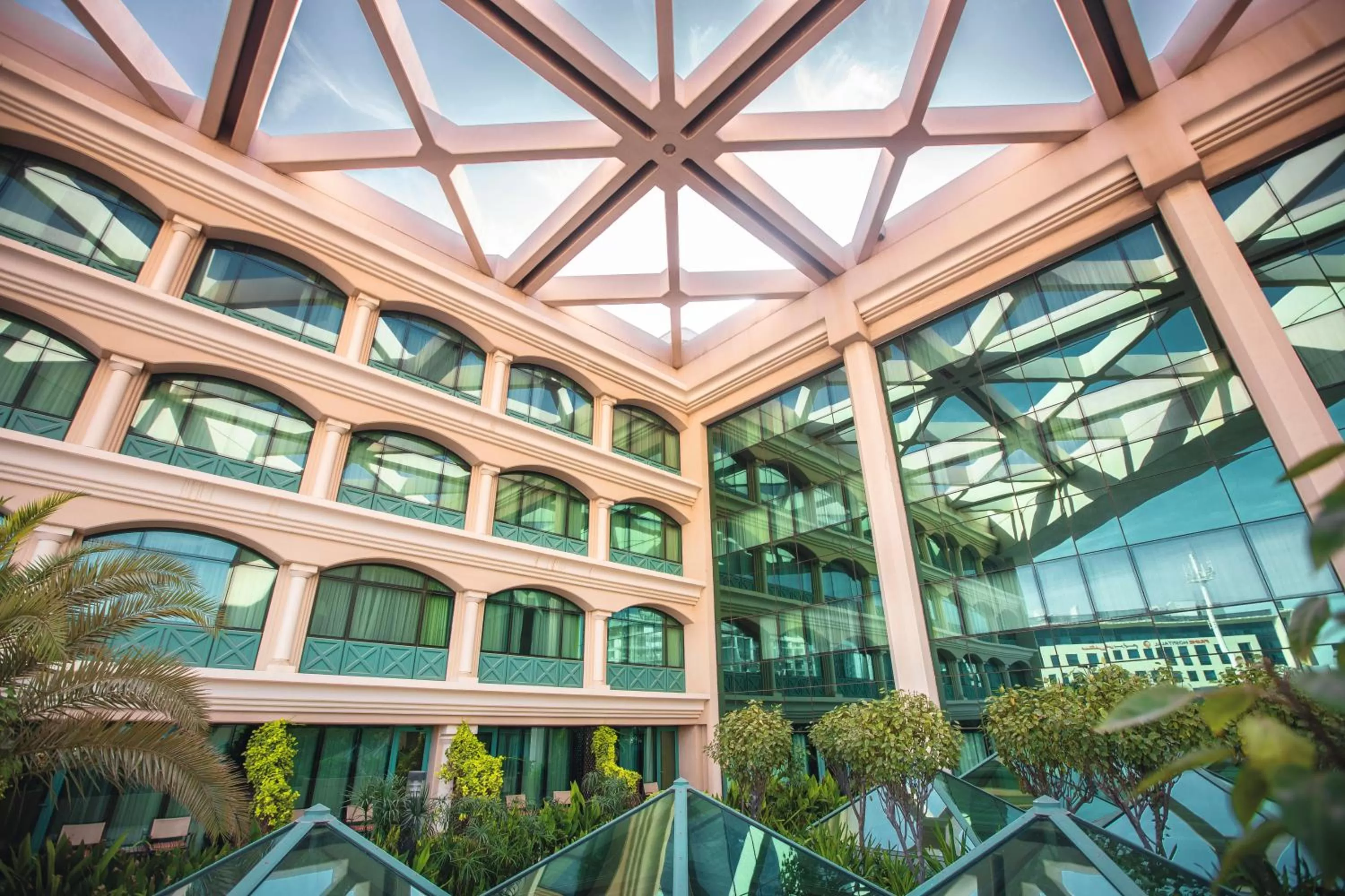 Garden view in Mövenpick Grand Al Bustan