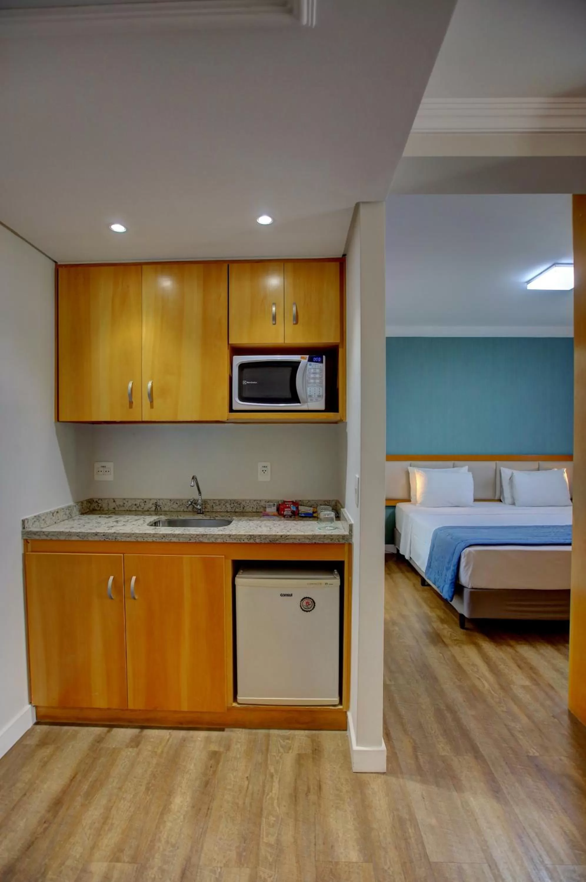 Kitchen or kitchenette, Bed in Quality Suítes Oscar Freire