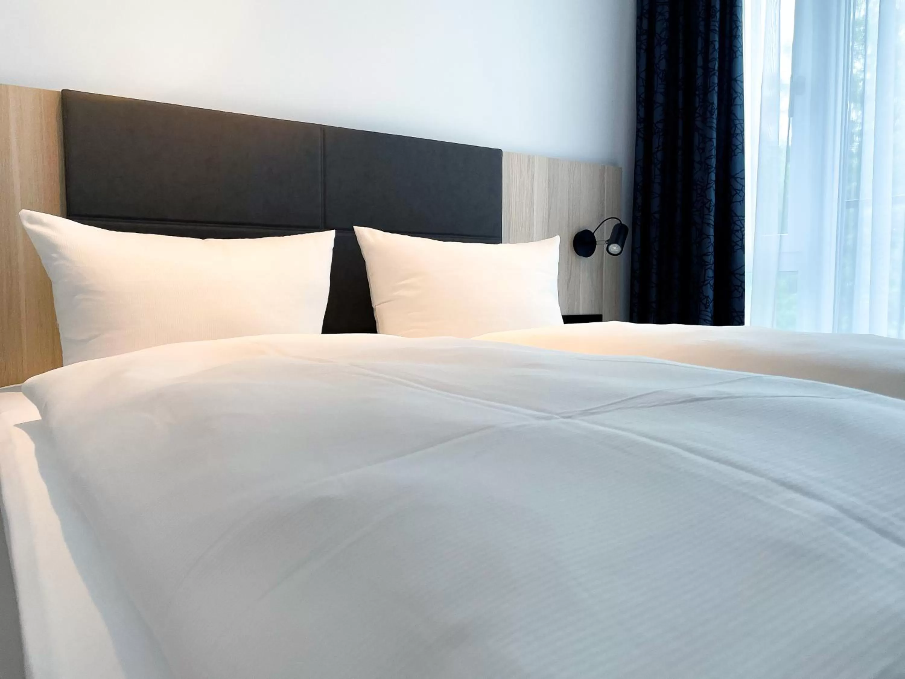 Bed in HOLI City Apart Hotel Berlin