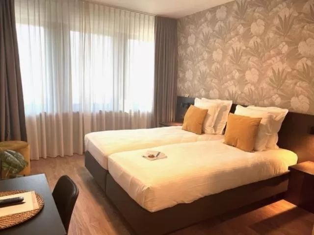 Bed in Bloomhotel