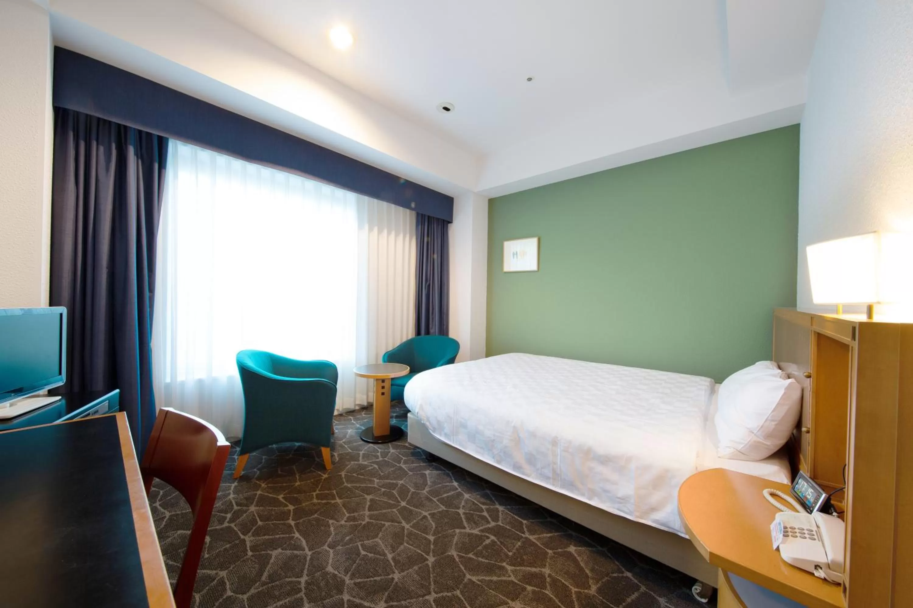 Bed in Hotel Nagoya Garden Palace