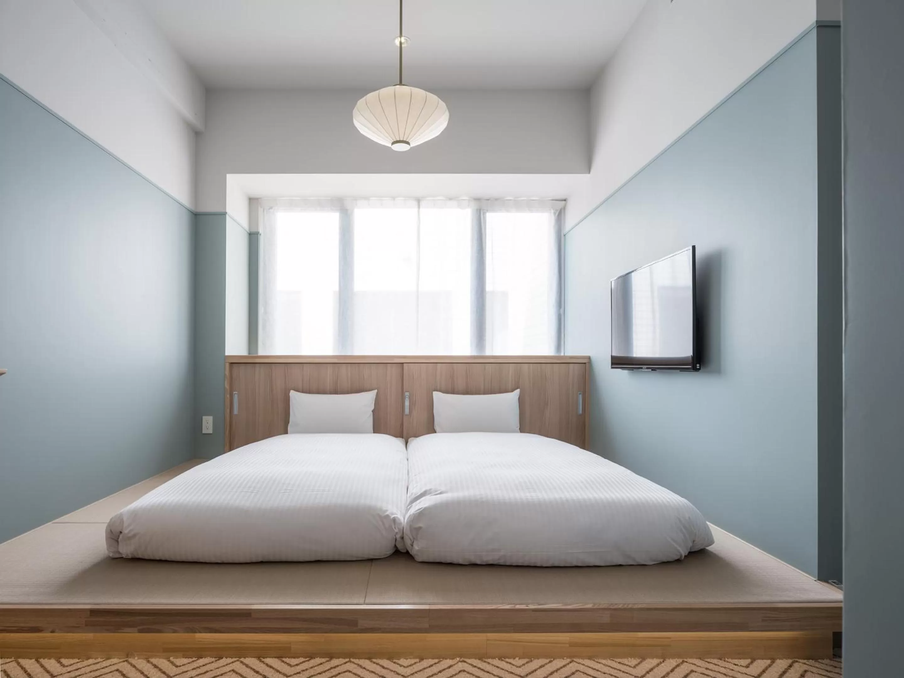 Photo of the whole room, Bed in RAKURO Kyoto by THE SHARE HOTELS