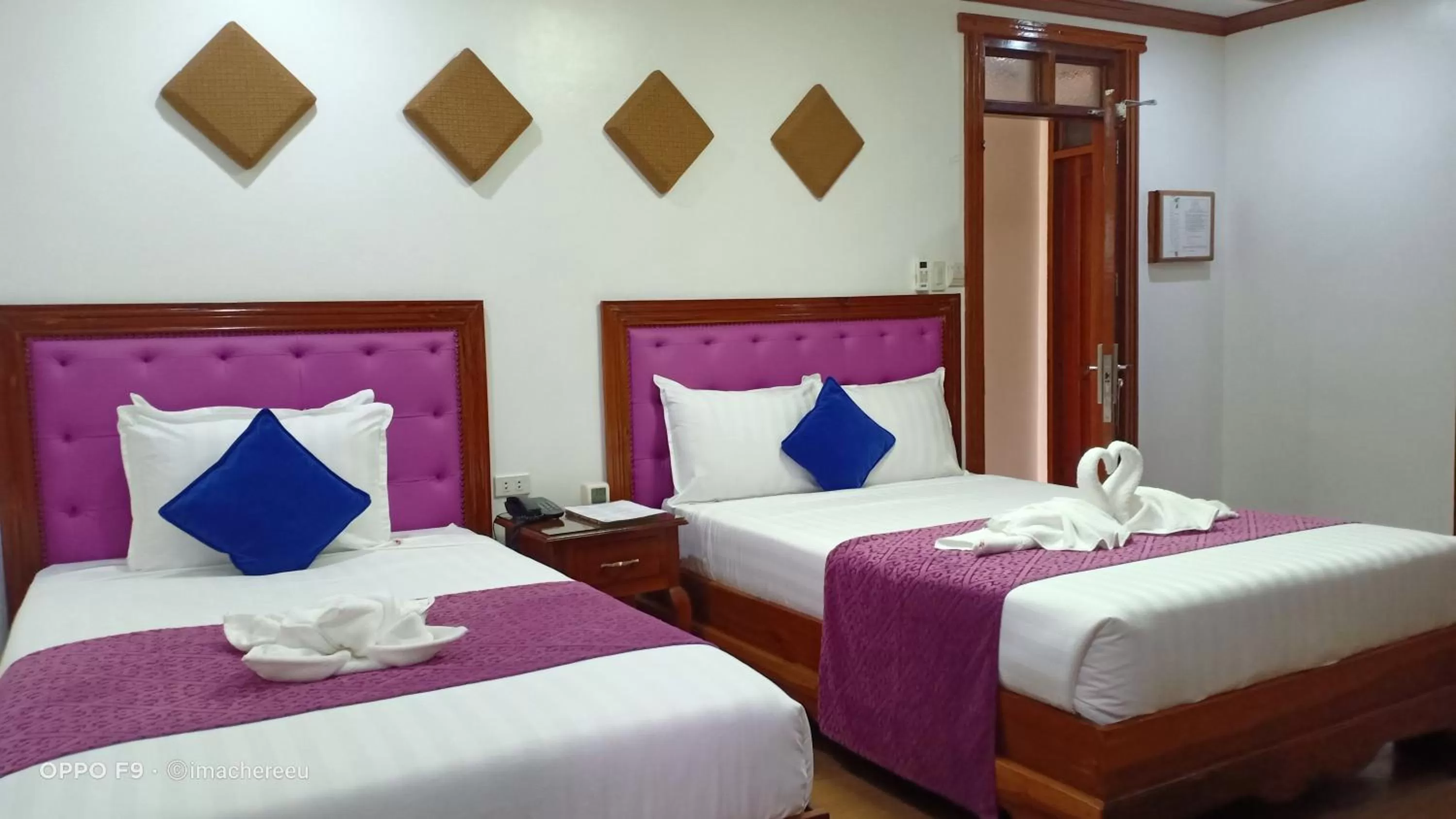 Bed in CLN Boutique Hotel