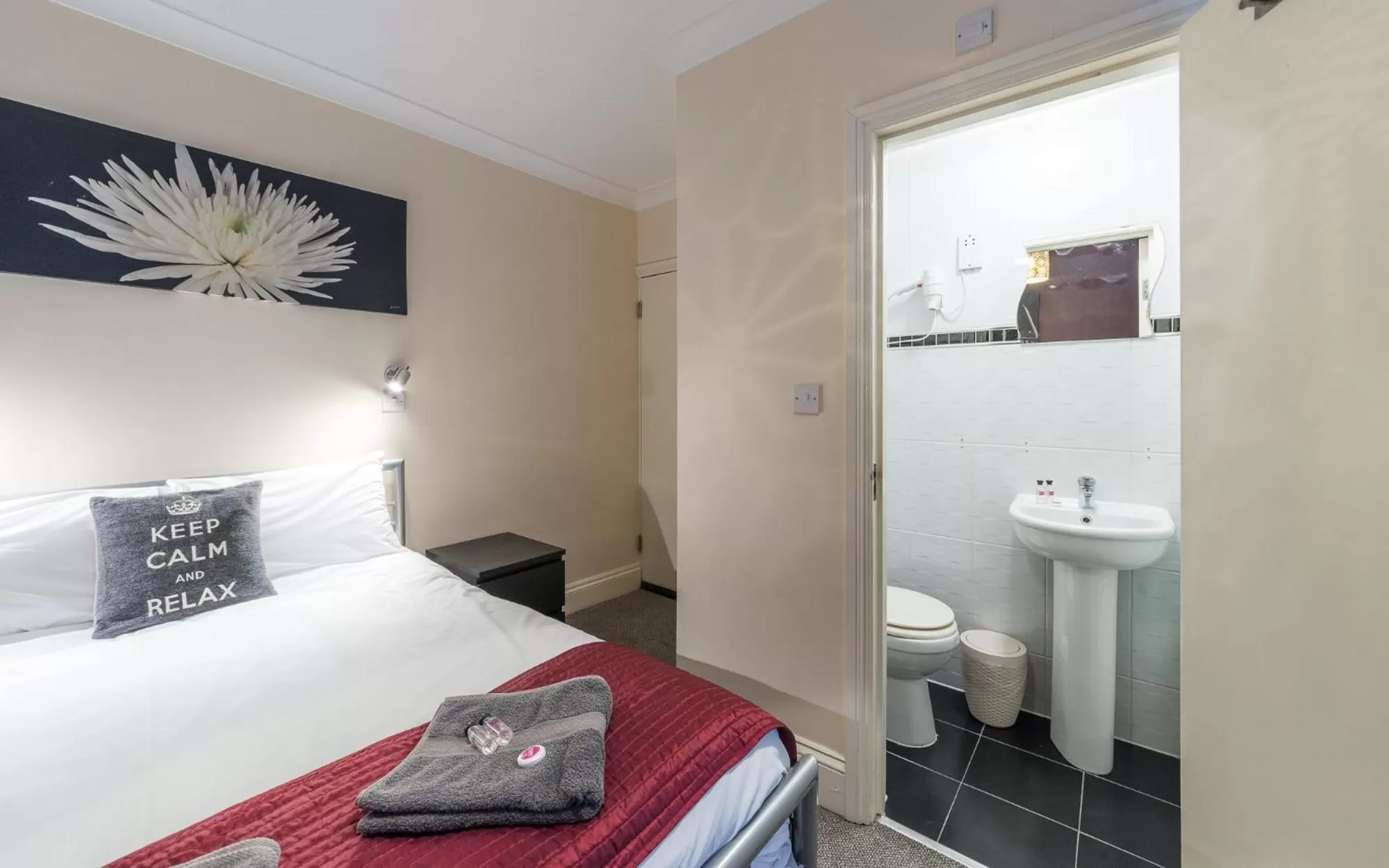 Bed in Hellenic Hotel by Saba