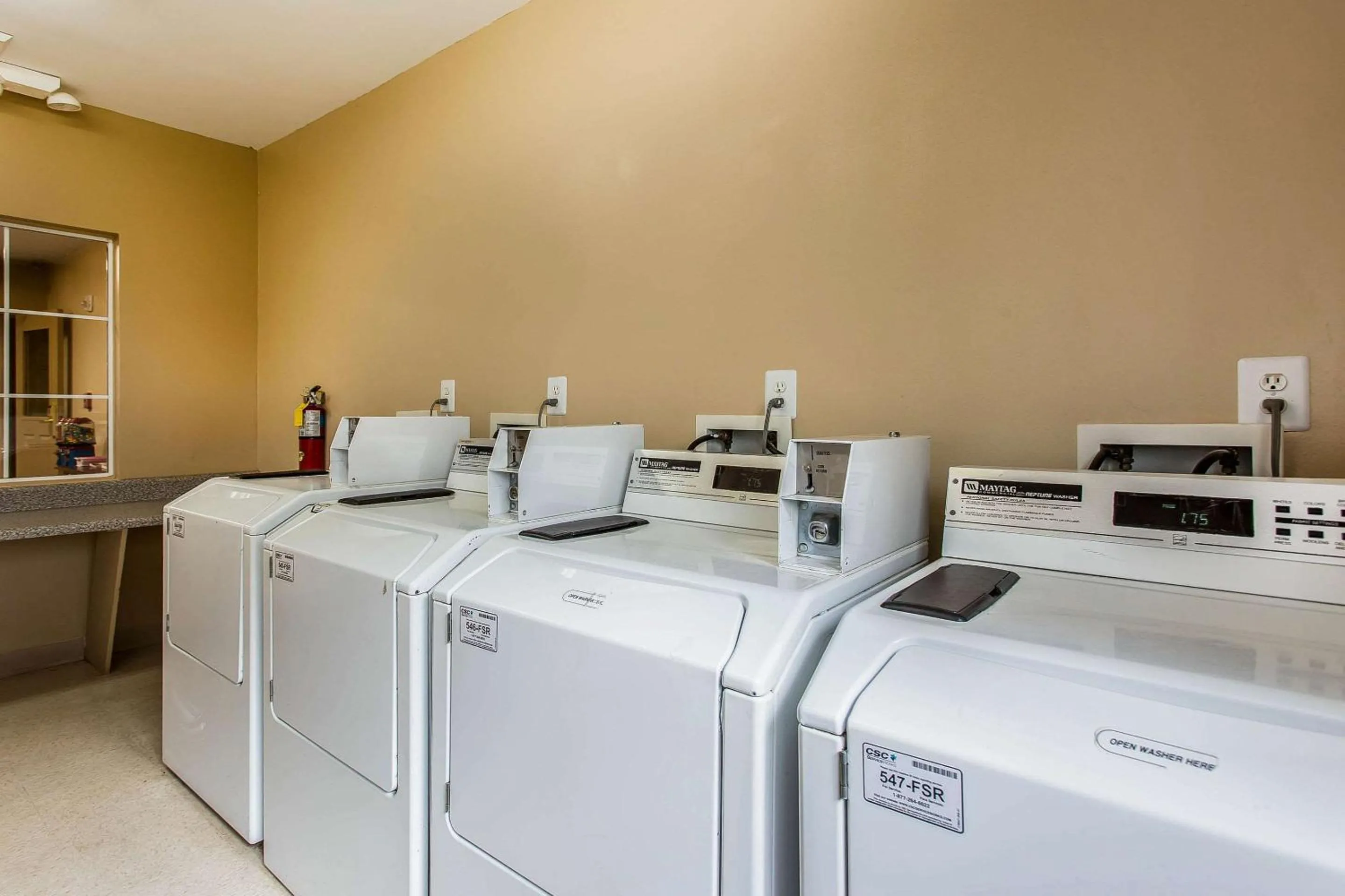 laundry in Suburban Studios near University of North Carolina-Charlotte