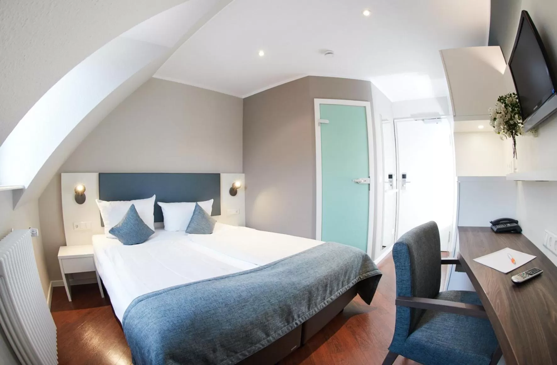 Photo of the whole room, Bed in Stadthotel Freiburg Kolping Hotels & Resorts