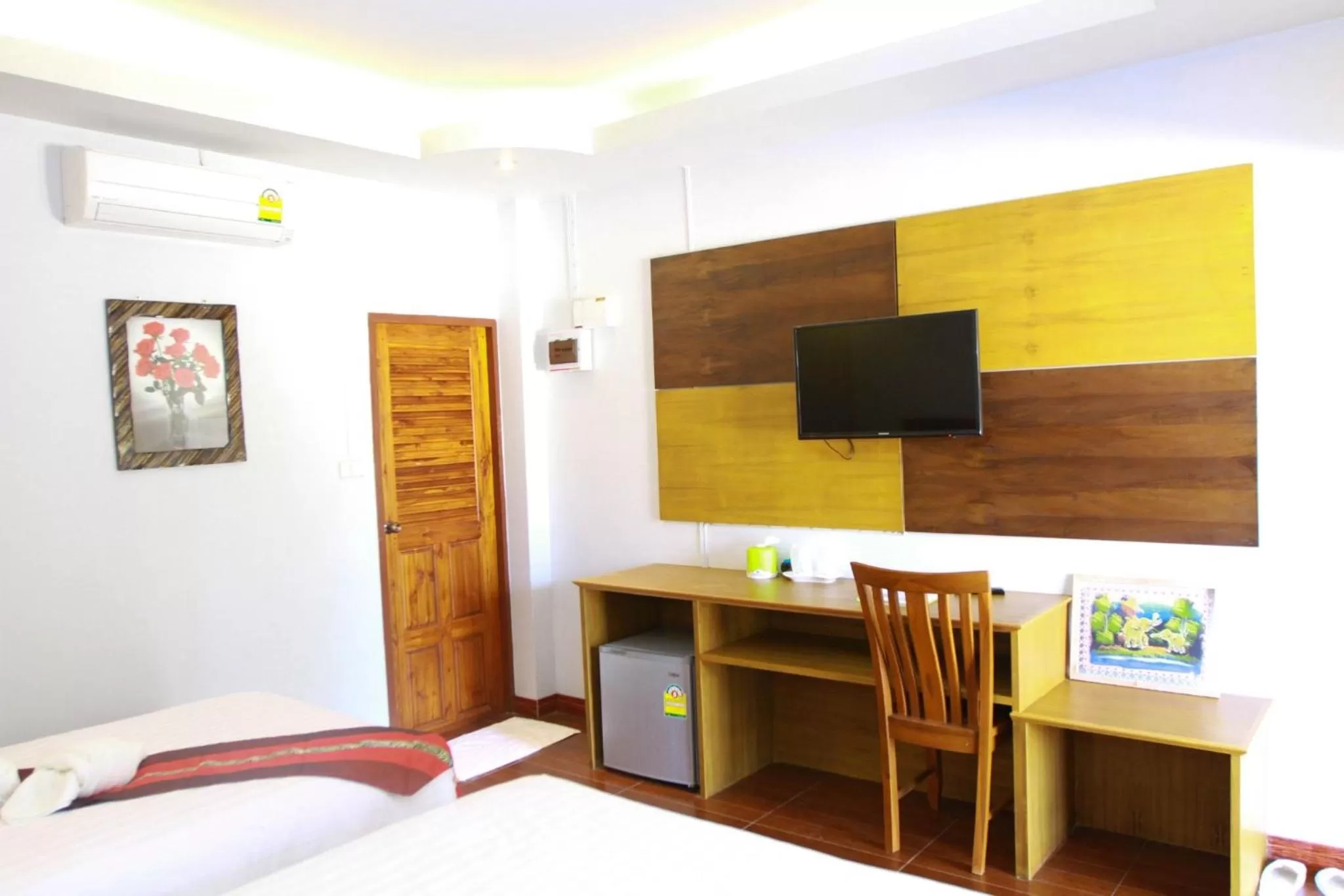 TV and multimedia, Bed in Hugpua Hotel