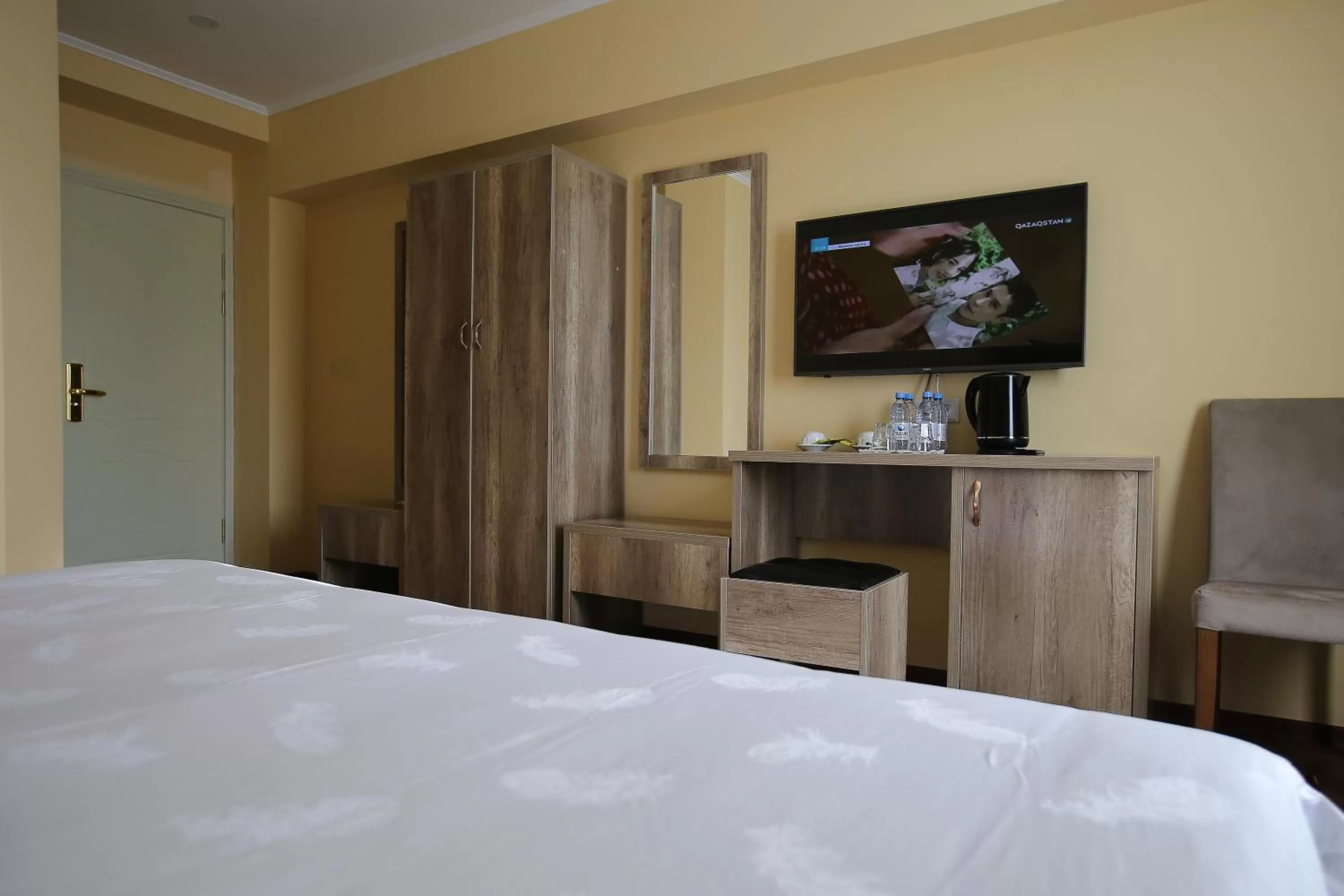 Bed in Altai Business Hotel