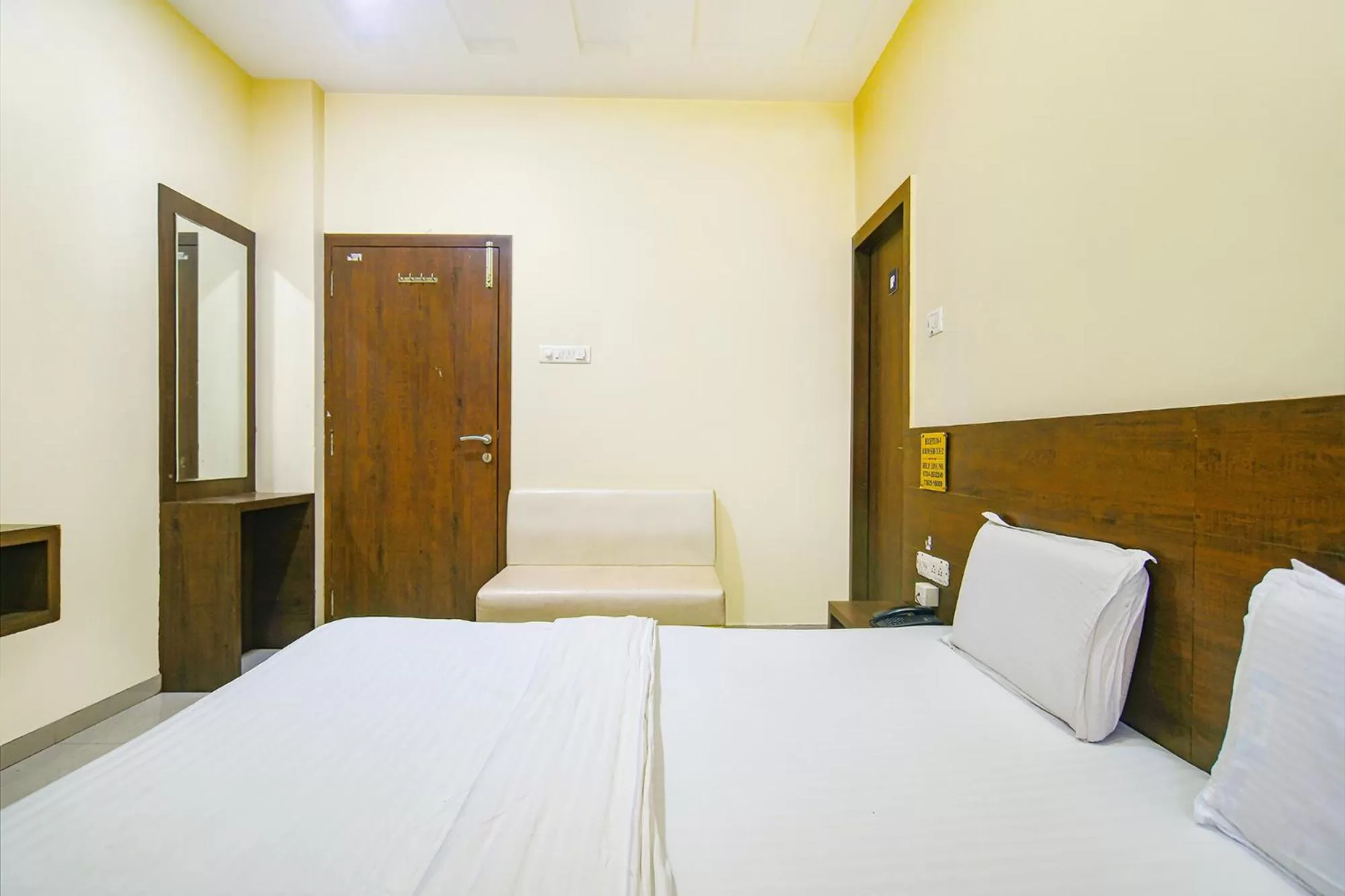 Bed in FabHotel Satyug Jaisinghpura