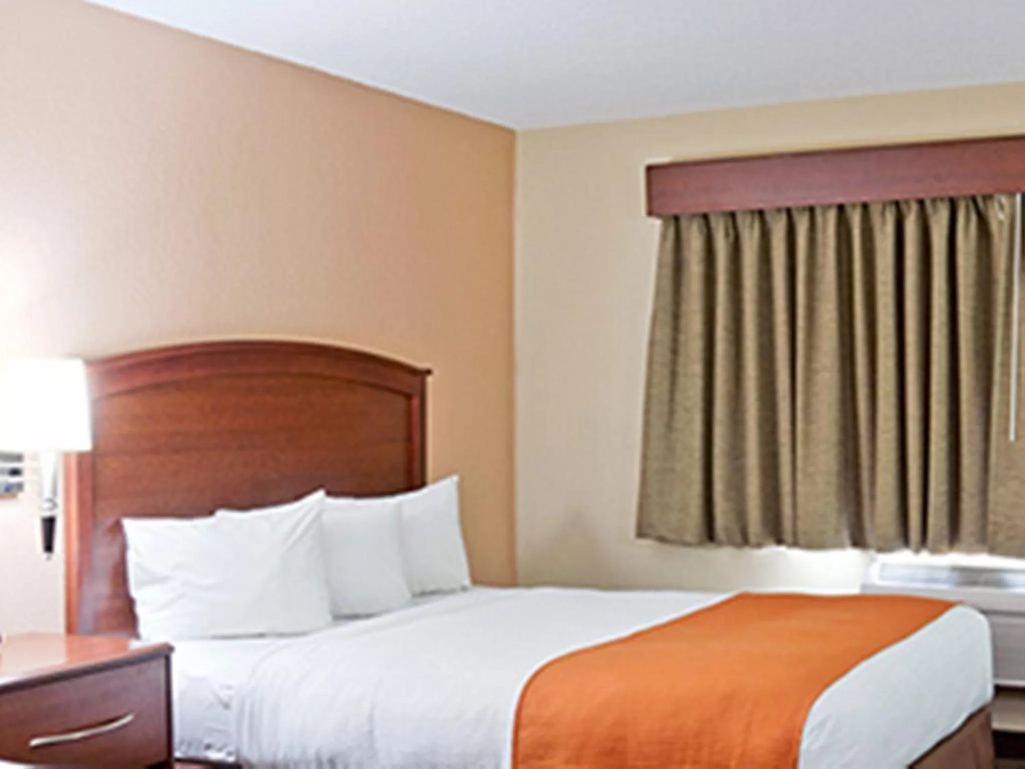 Bed in AmericInn by Wyndham Fargo West Acres