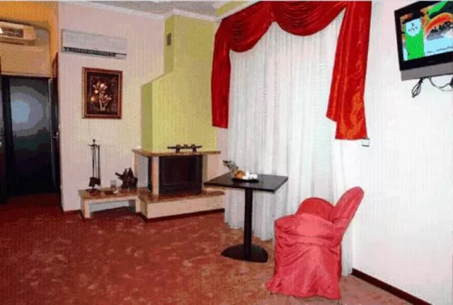 Seating area, TV/Entertainment Center in Achillion Palace