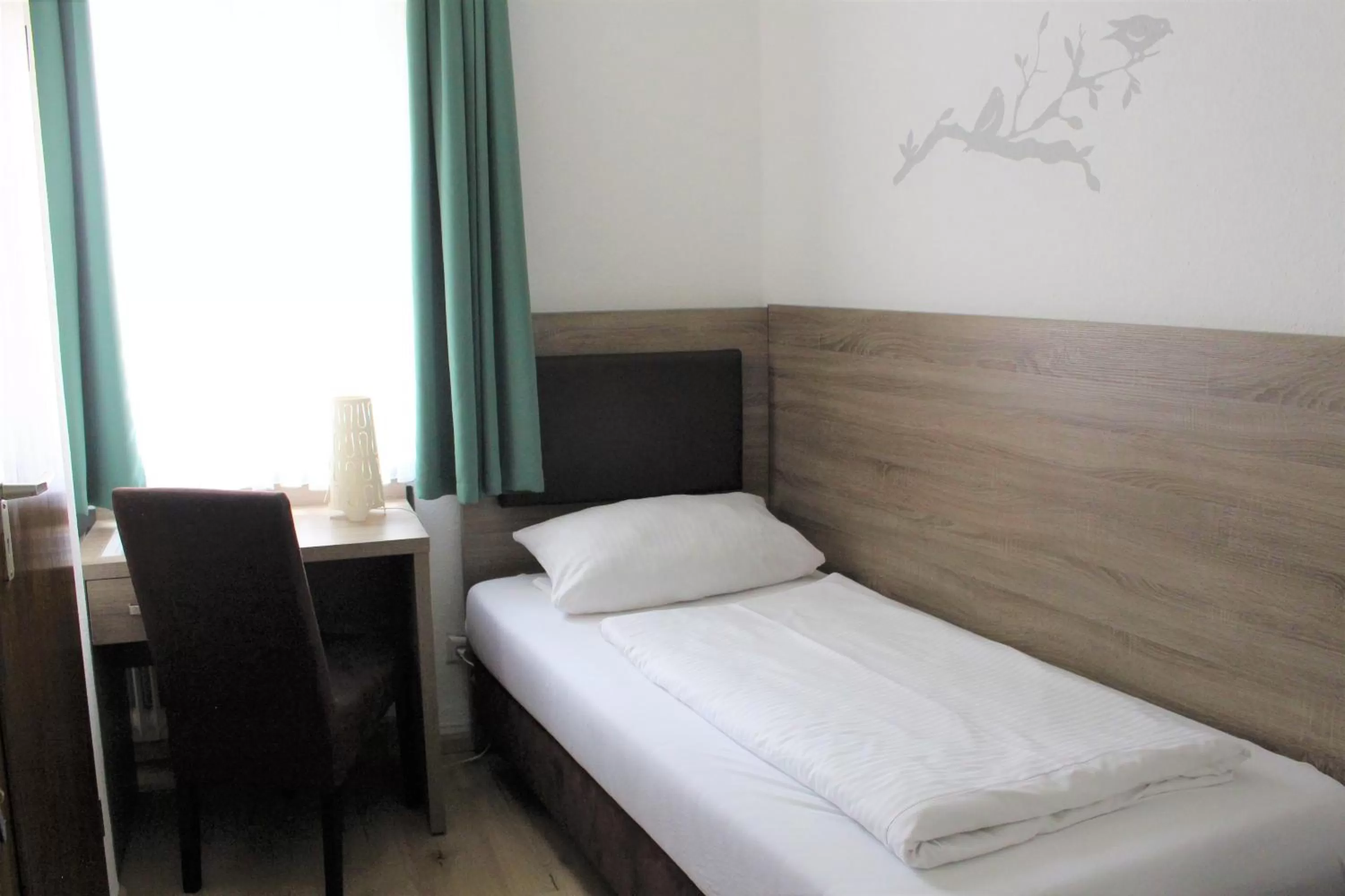 Bed in Hotel Ulmer Spatz