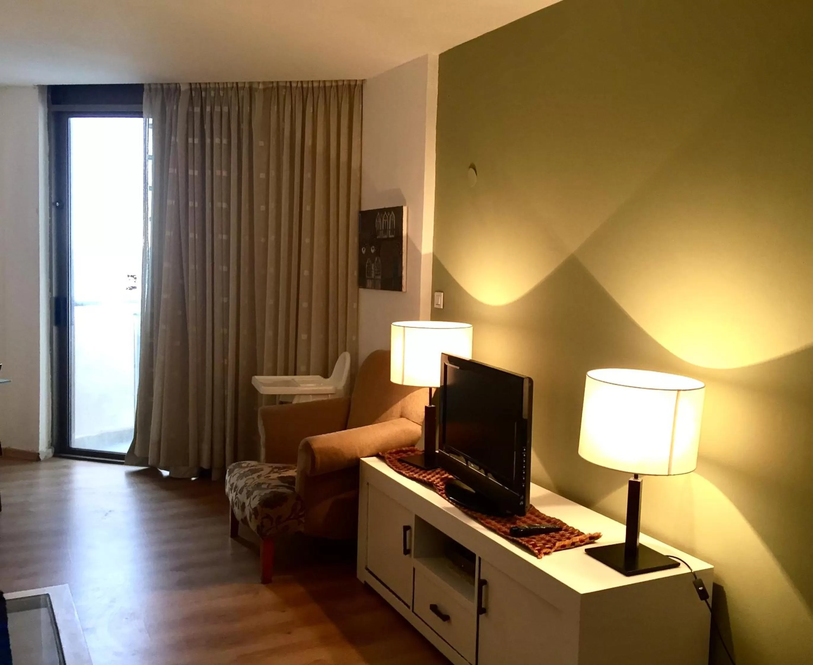 Living room, TV/Entertainment Center in Raphael Apartments