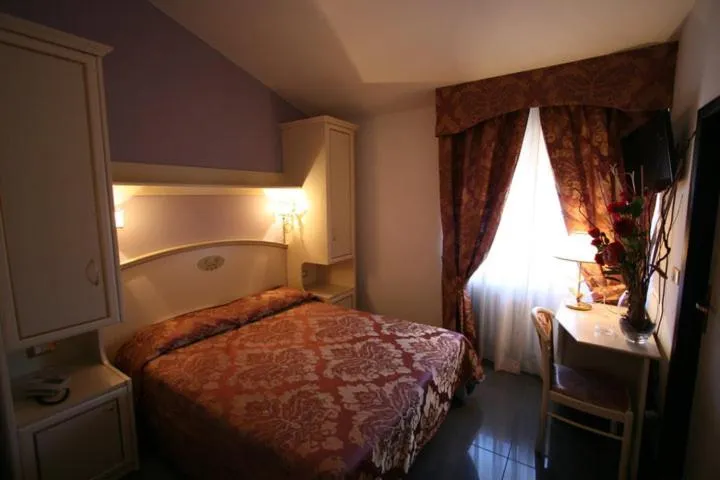 Bed in Hotel La Meridiana