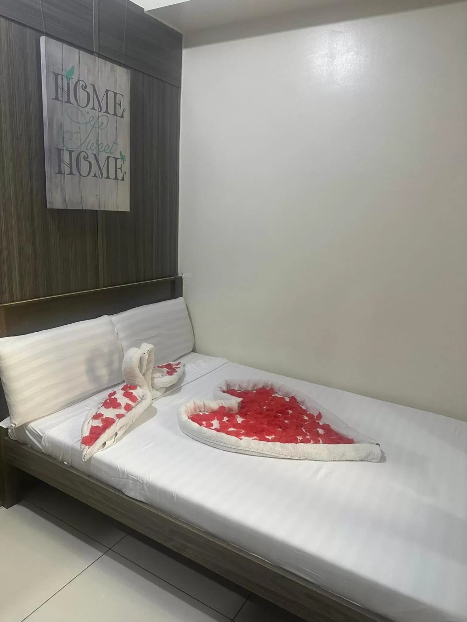 Bed in Green Residences Stays by PBYY