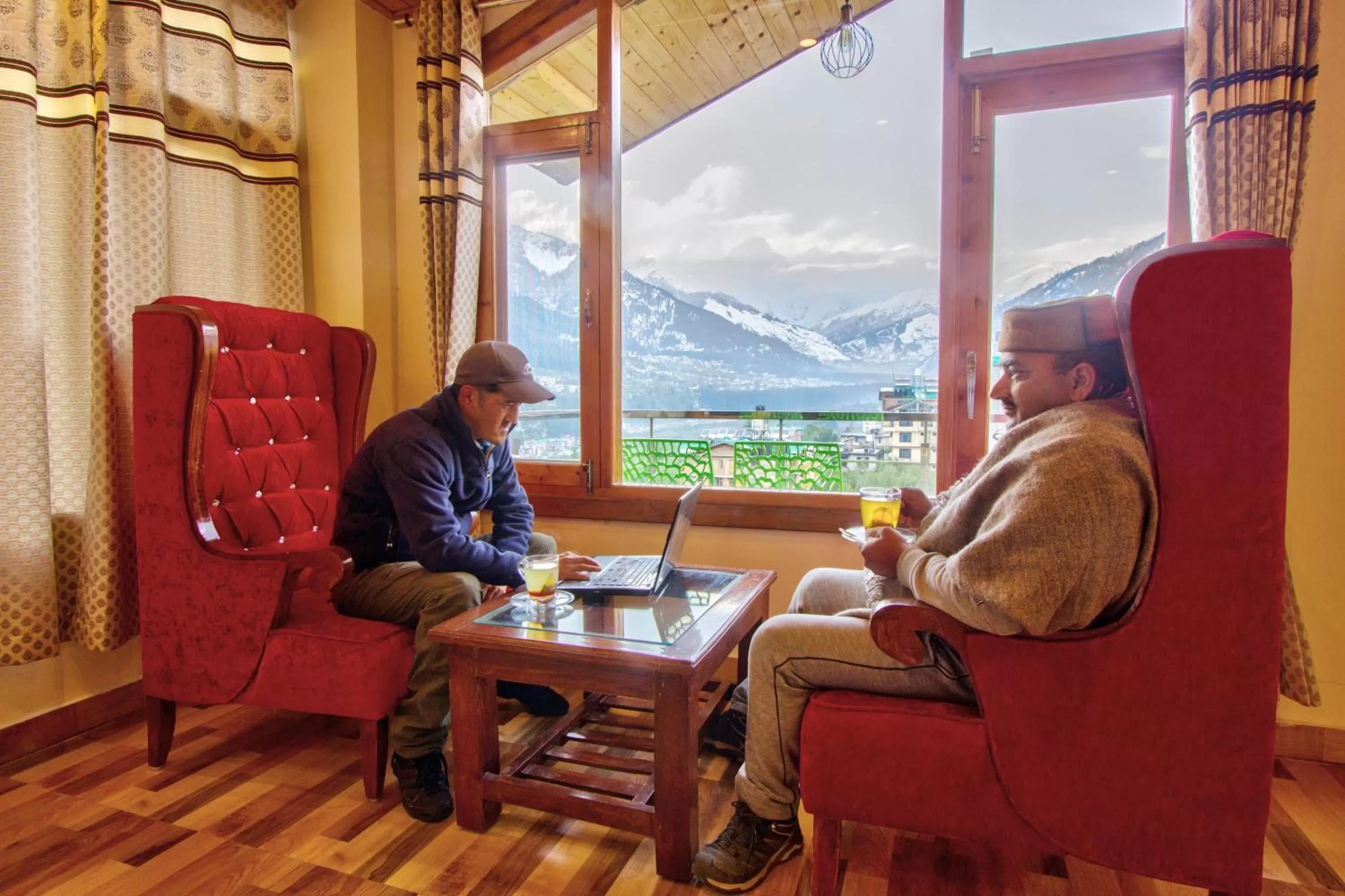 Seating area in Snow City's Montana Blues Resort Manali - Heated & Air-Cooled Stay