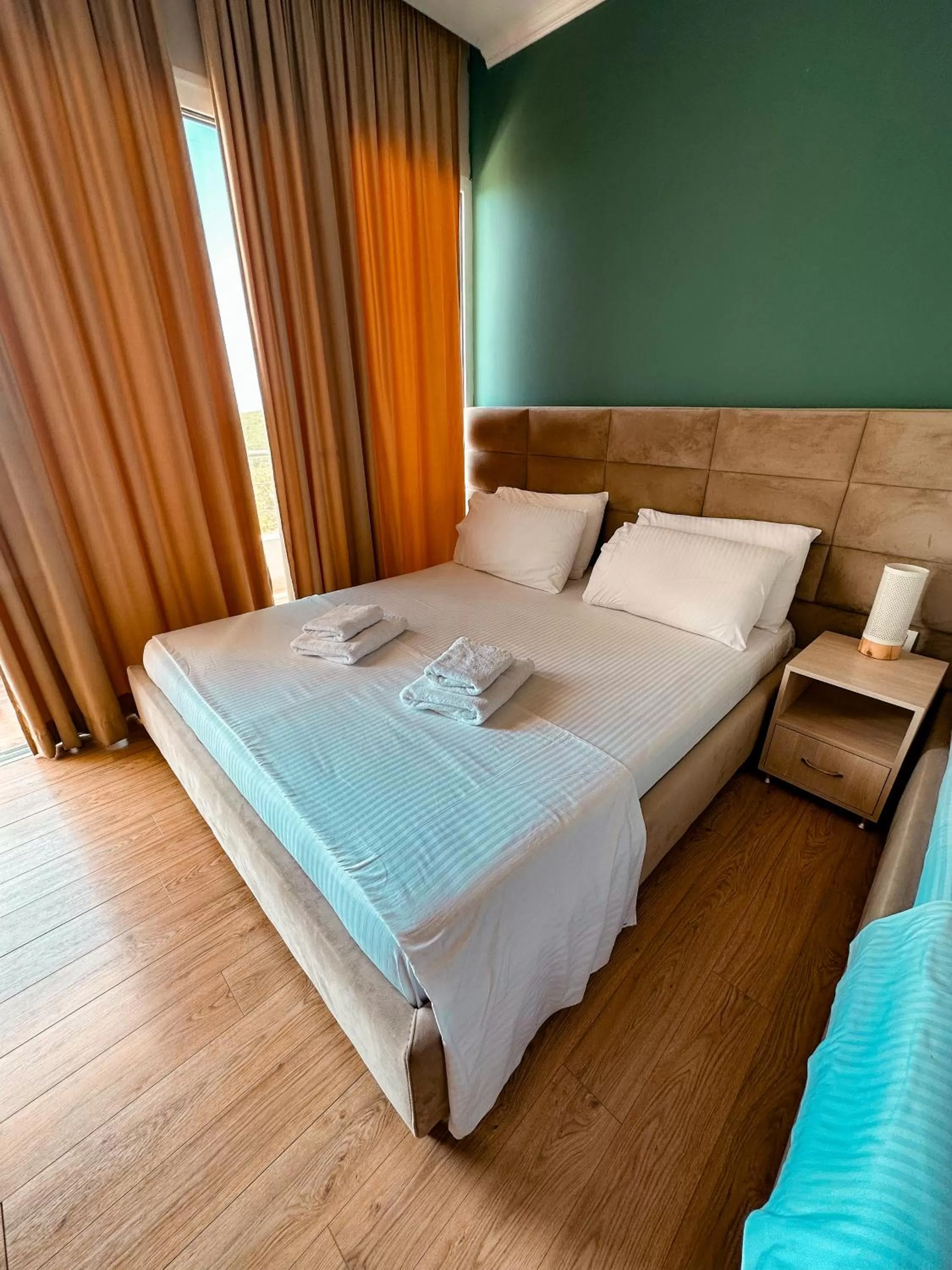 Bed in Aphrodite Garden Rooms & Apartment