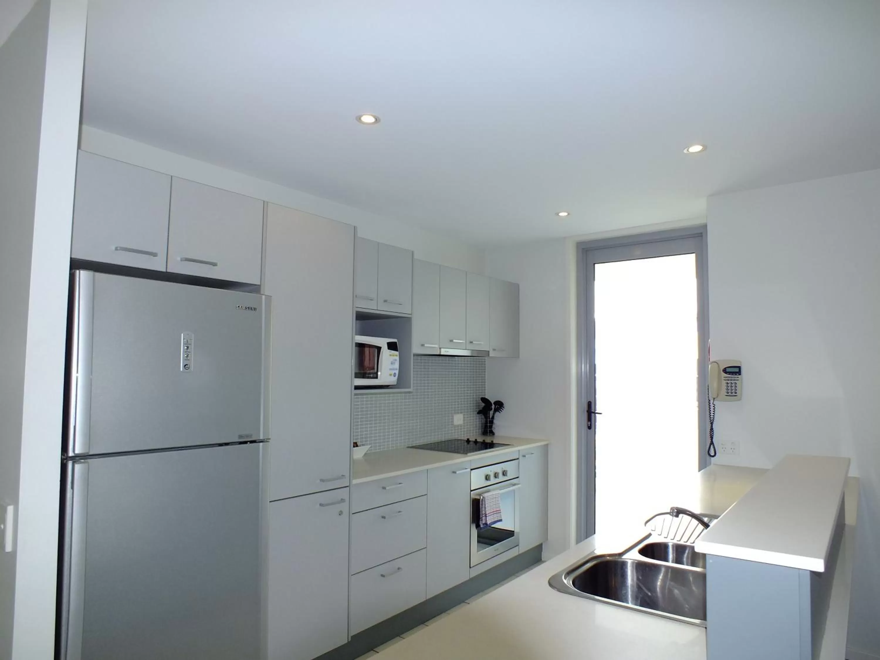 Kitchen or kitchenette in Pacific Marina Apartments