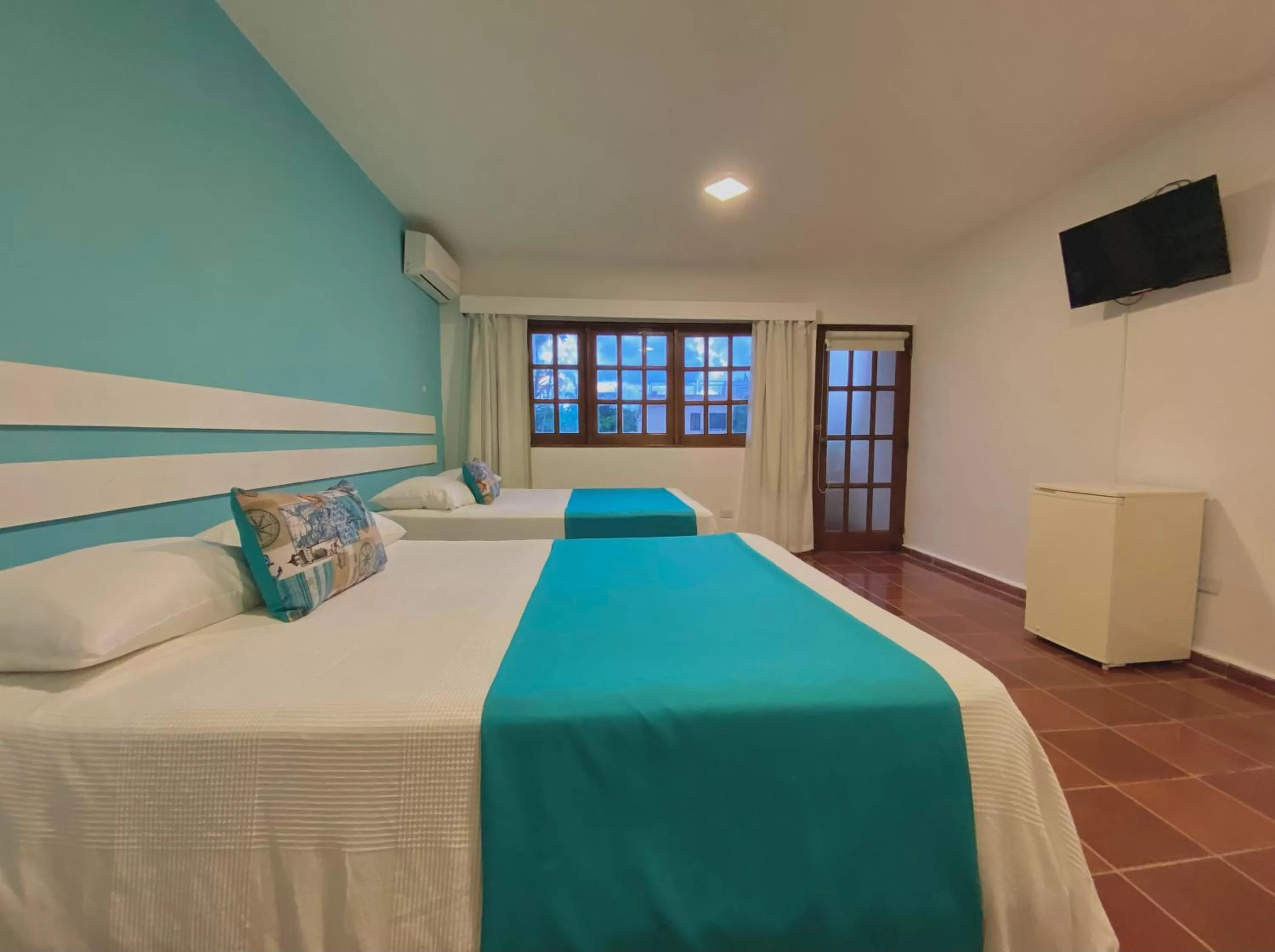 Bed in Calypso Beach Hotel by The Urbn House Santo Domingo Airport