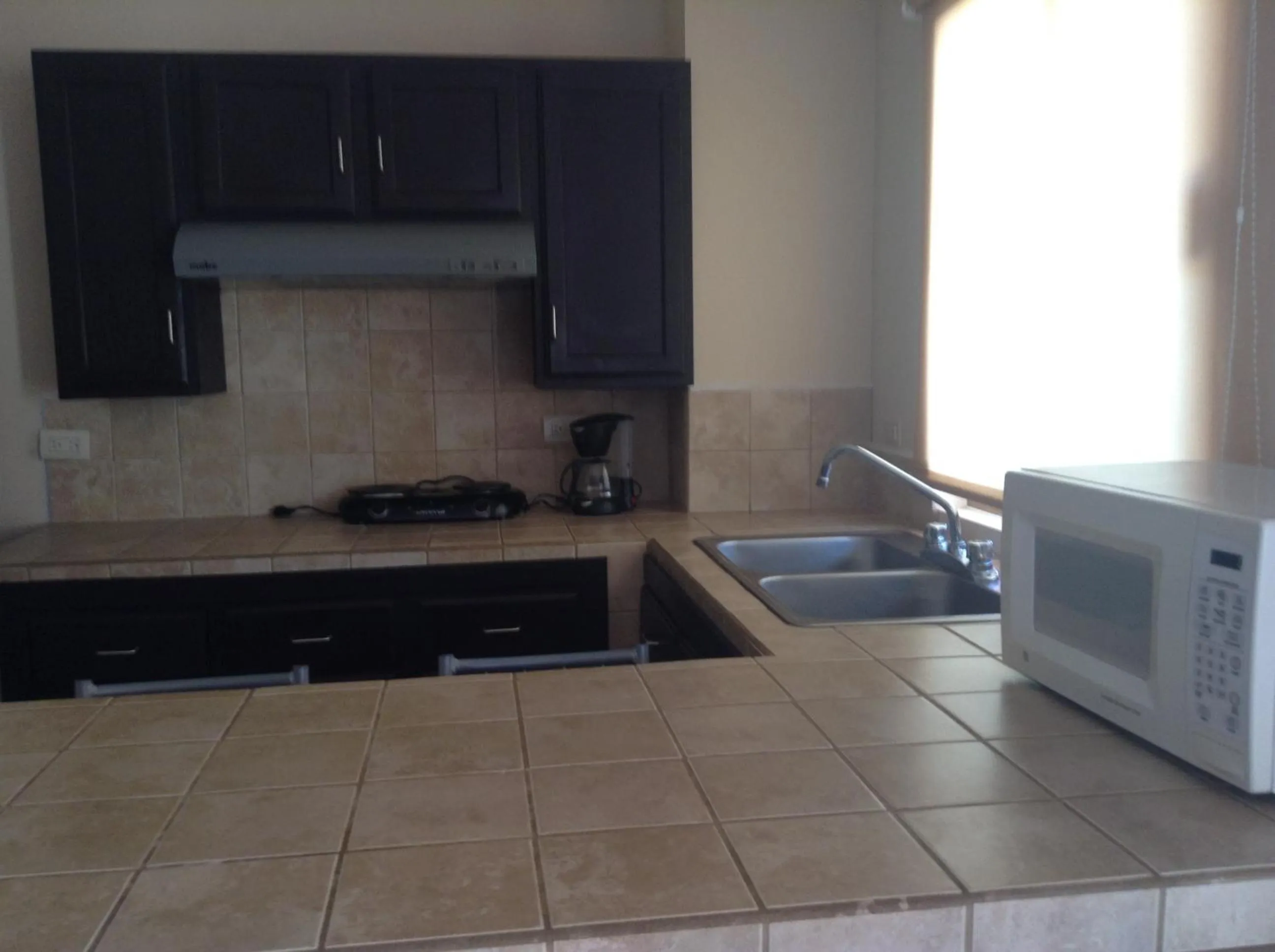 Kitchen or kitchenette in Los Jitos Hotel & Suites