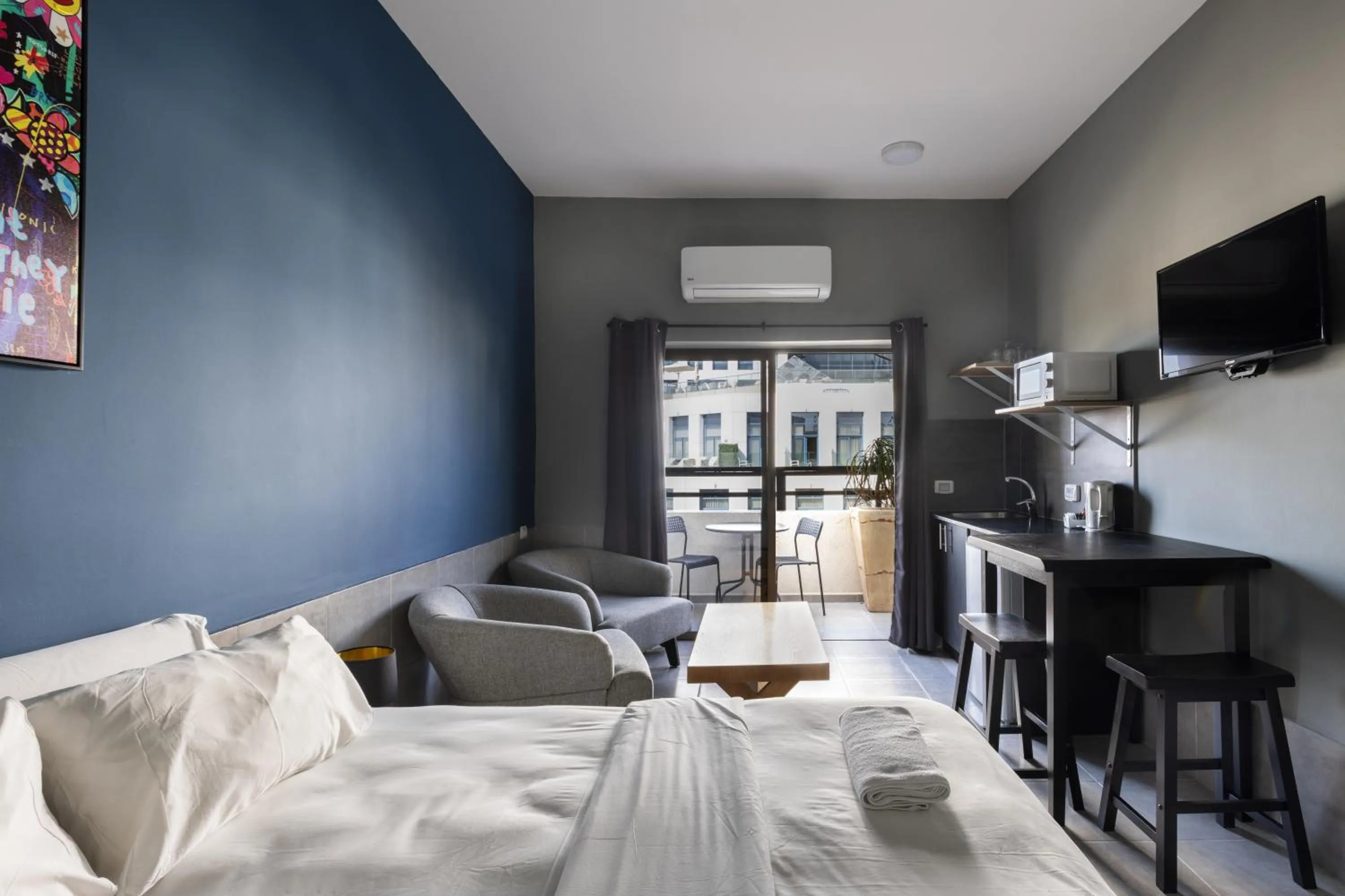 Photo of the whole room, Bed in Liber Tel Aviv Sea Shore Suites BY RAPHAEL HOTELS