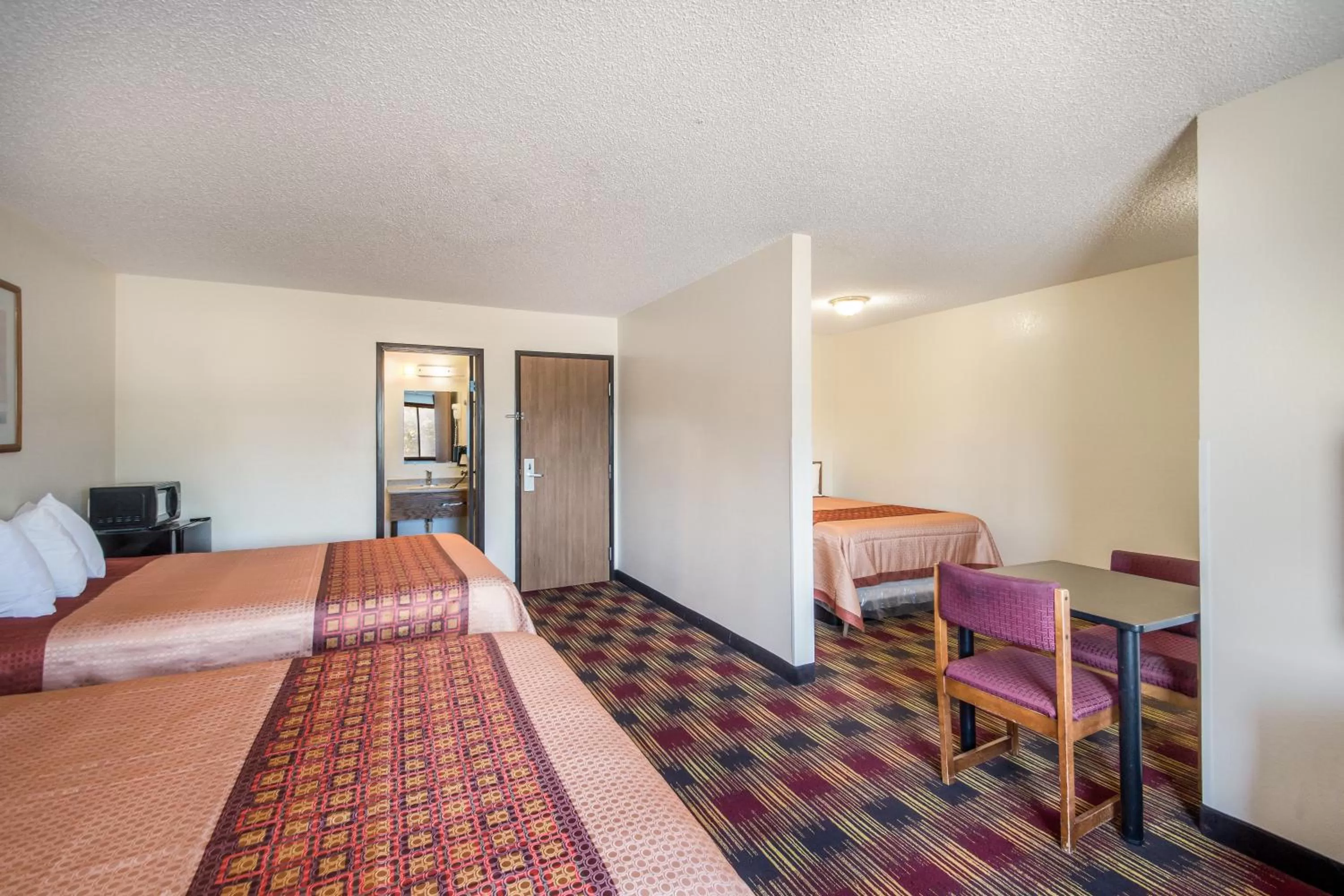 Bed in Americas Best Value Inn & Suites Harrisonville