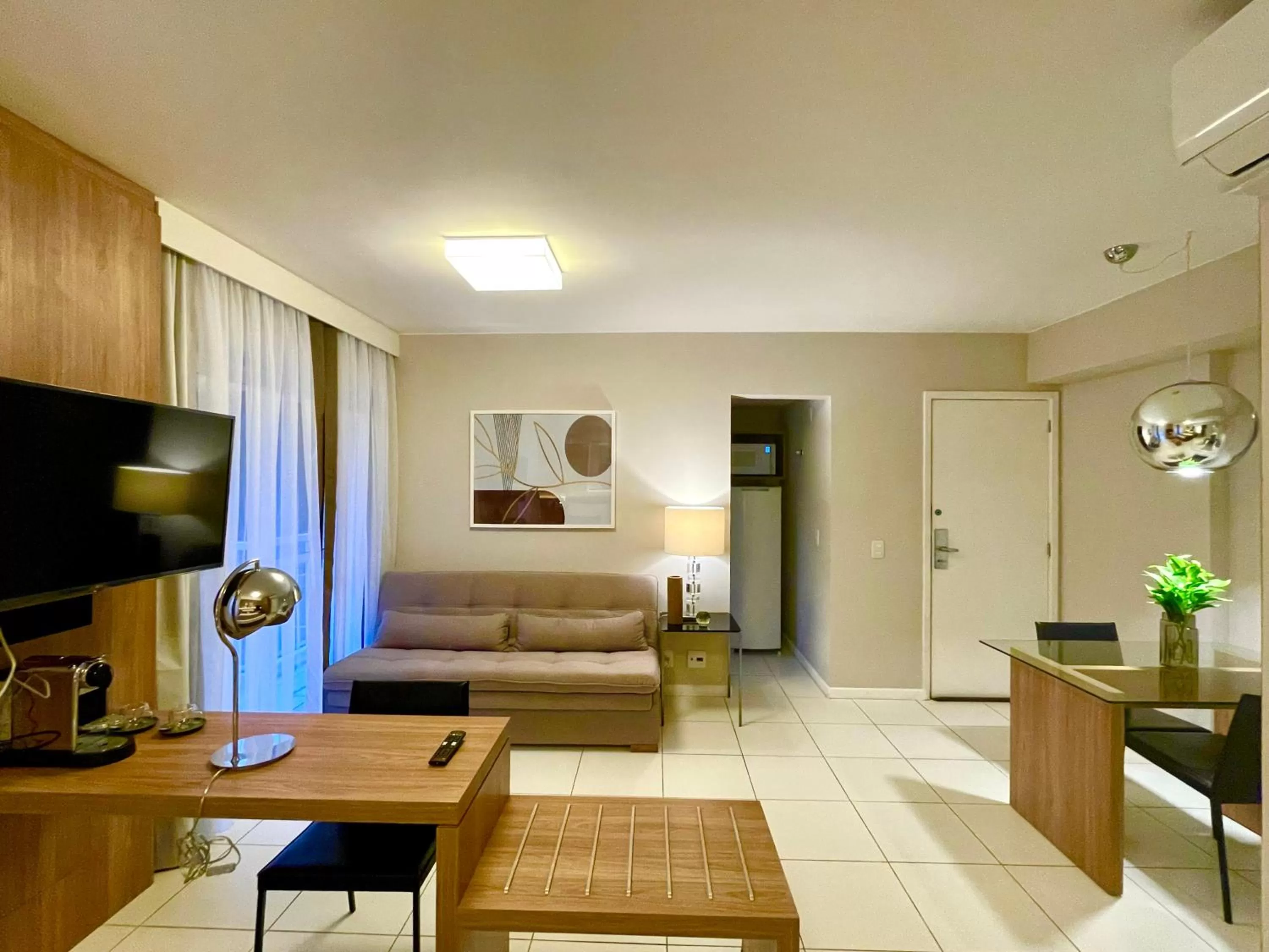 TV and multimedia, Seating Area in Suíte & Flat Premium Rio Stay - Rio Centro