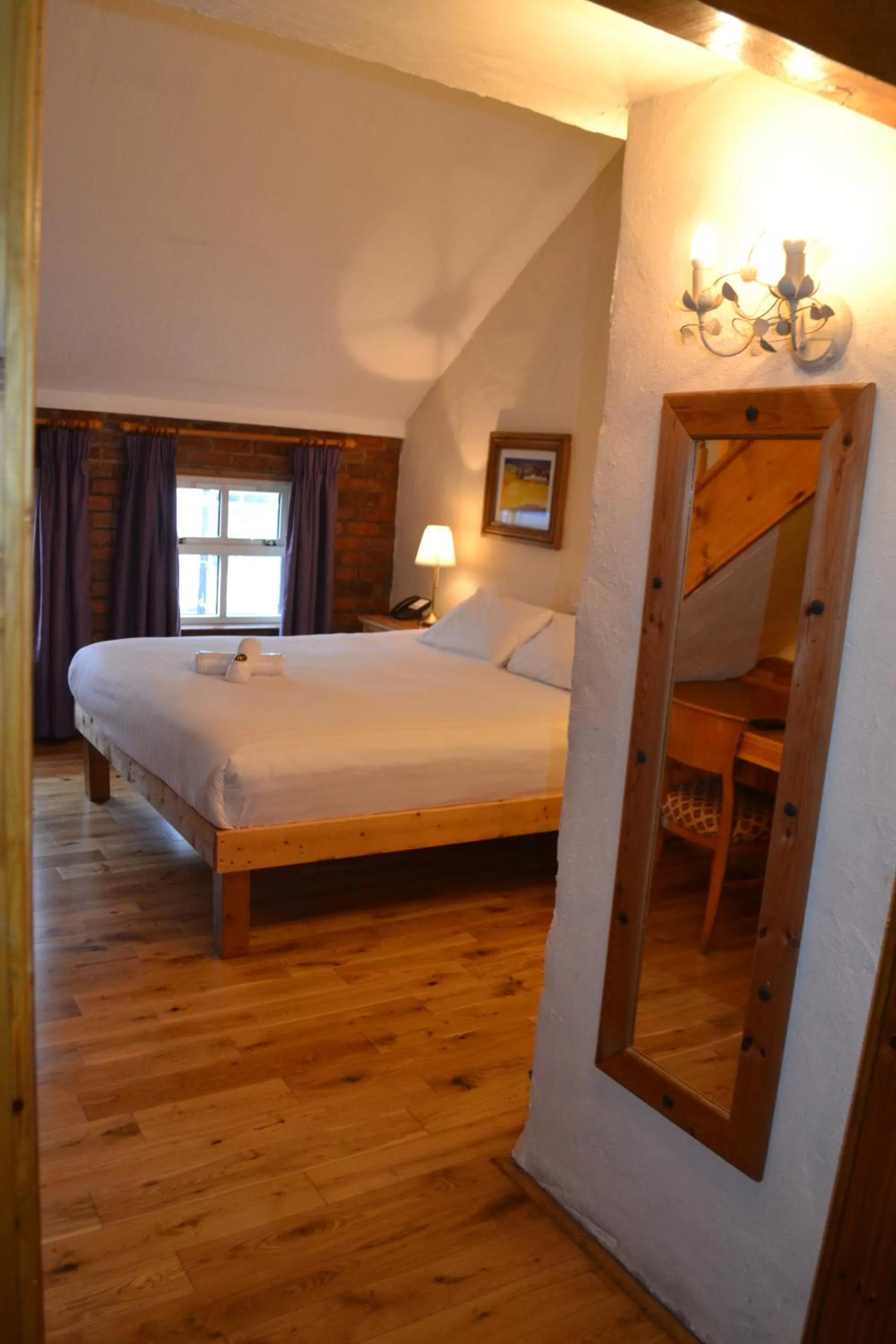 Bed in Walsh's Hotel and Apartments