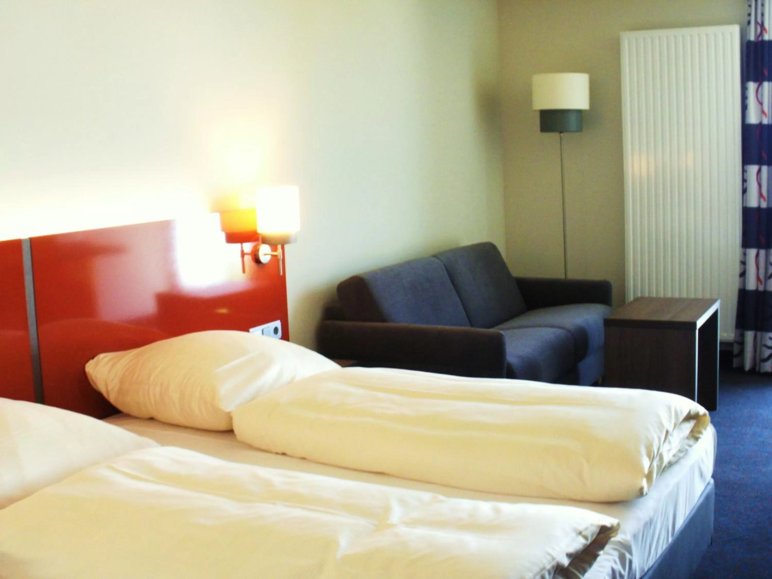 Photo of the whole room, Bed in iQ-Hotel Ulm